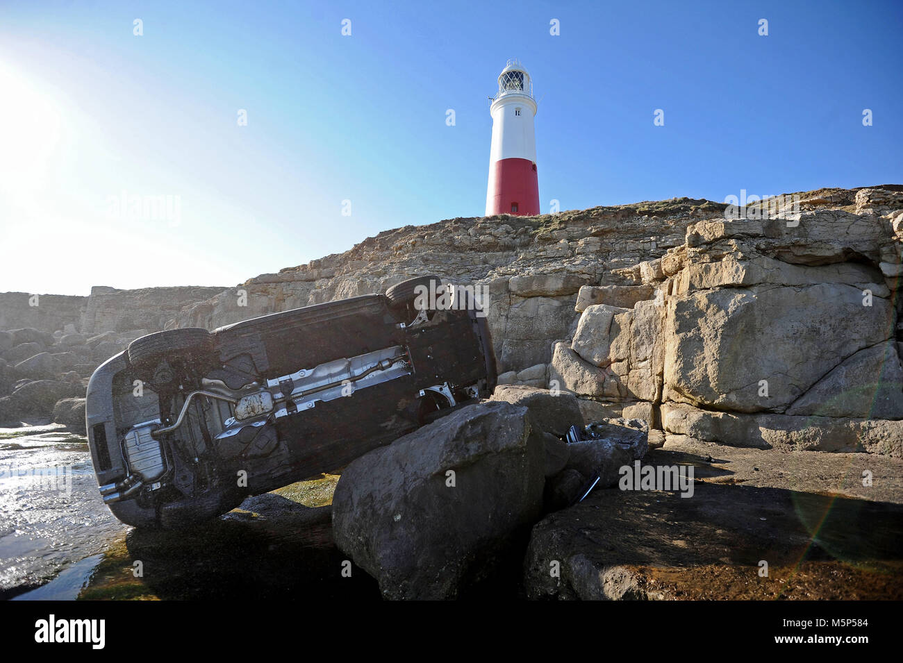 Car plunges from cliff, Portland Bill, Dorset, UK Credit: Finnbarr Webster/Alamy Live News Stock Photo