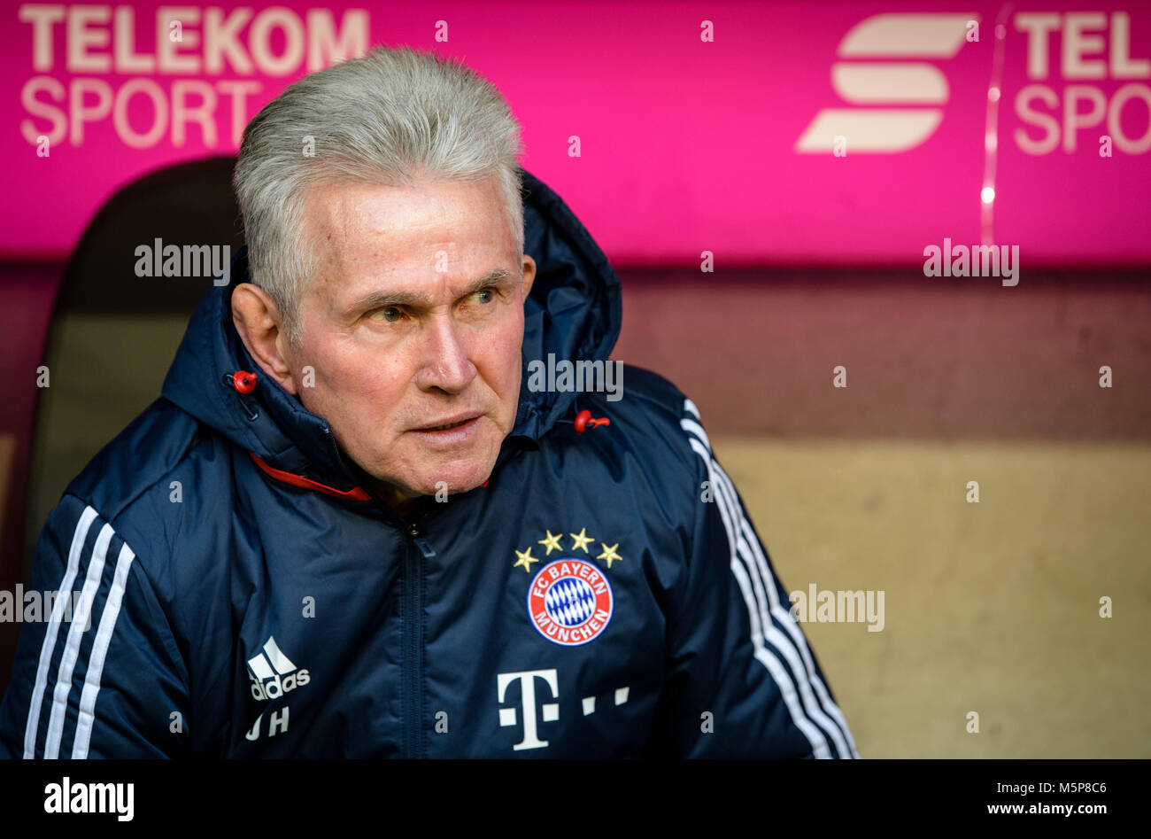 24 Febuary 2018, Germany, Munich: German Bundesliga soccer match between Bayern Munich and Hertha BSC, Allianz Arena. Bayern's coach Jupp Heynckes sitting on the bench before the game. Photo: Matthias Balk/dpa - Nutzung nur nach vertraglicher Vereinbarung Stock Photo