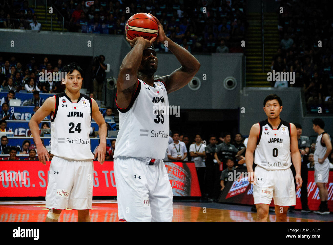 Philippines. 25th Feb, 2018. Ira Brown (35) of team Japan lines up a shot during the qualifying game at the MOA Arena. The Philippine and Japanese basketball team met at the hardcourt of the Mall of Asia Arena in Pasay City, for the FIBA World Cup 2019 Asian Qualifiers. The Philippines won over Japan, 89-84. Credit: J Gerard Seguia/ZUMA Wire/Alamy Live News Stock Photo