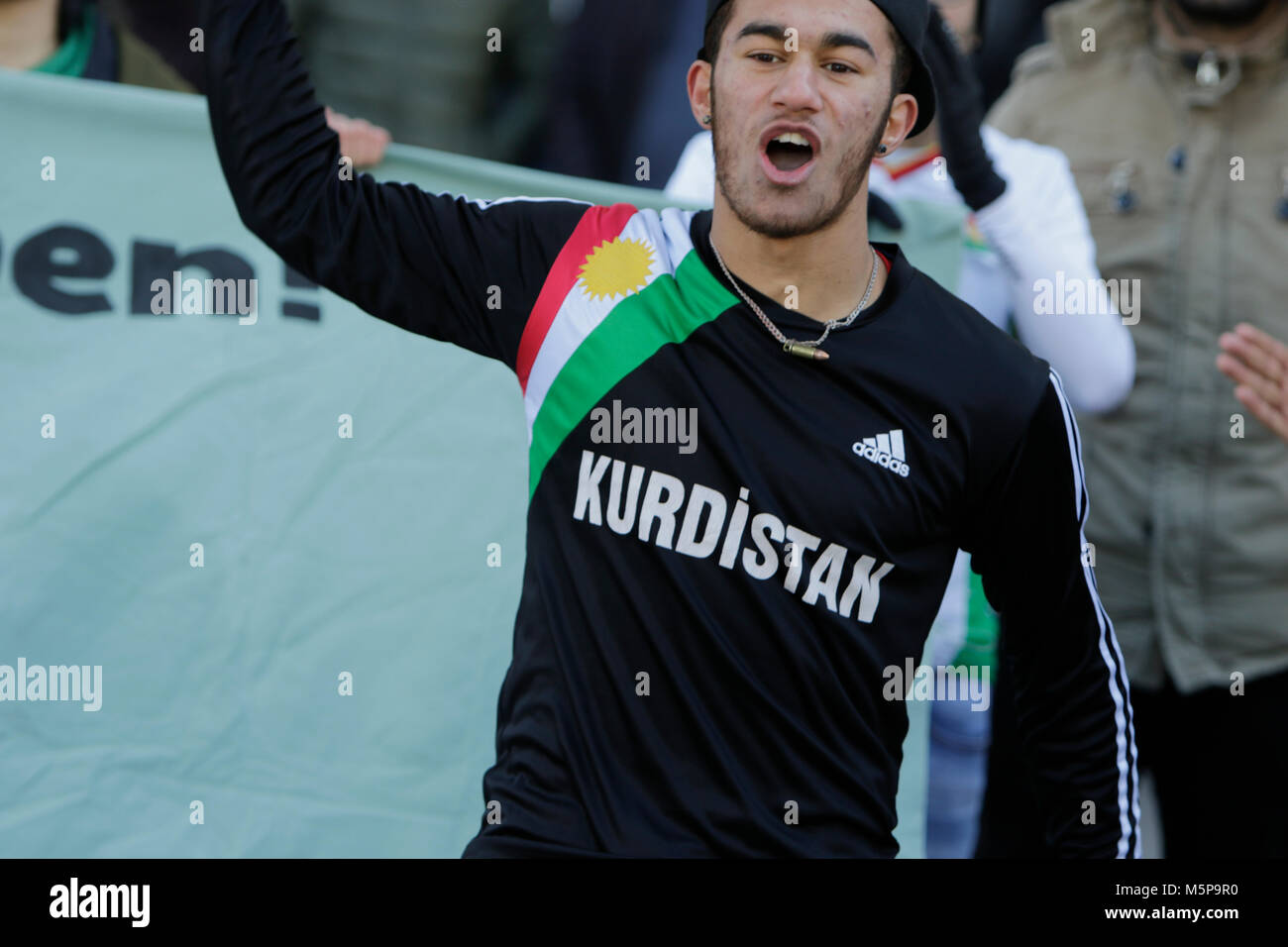 Mannheim, Germany. 25th February 2018. A protester wears a Kurdistan  T-Shirt. Turkish and Kurdish protesters faced each others at protests in  the city centre of Mannheim. The Turkish protesters supported the attack