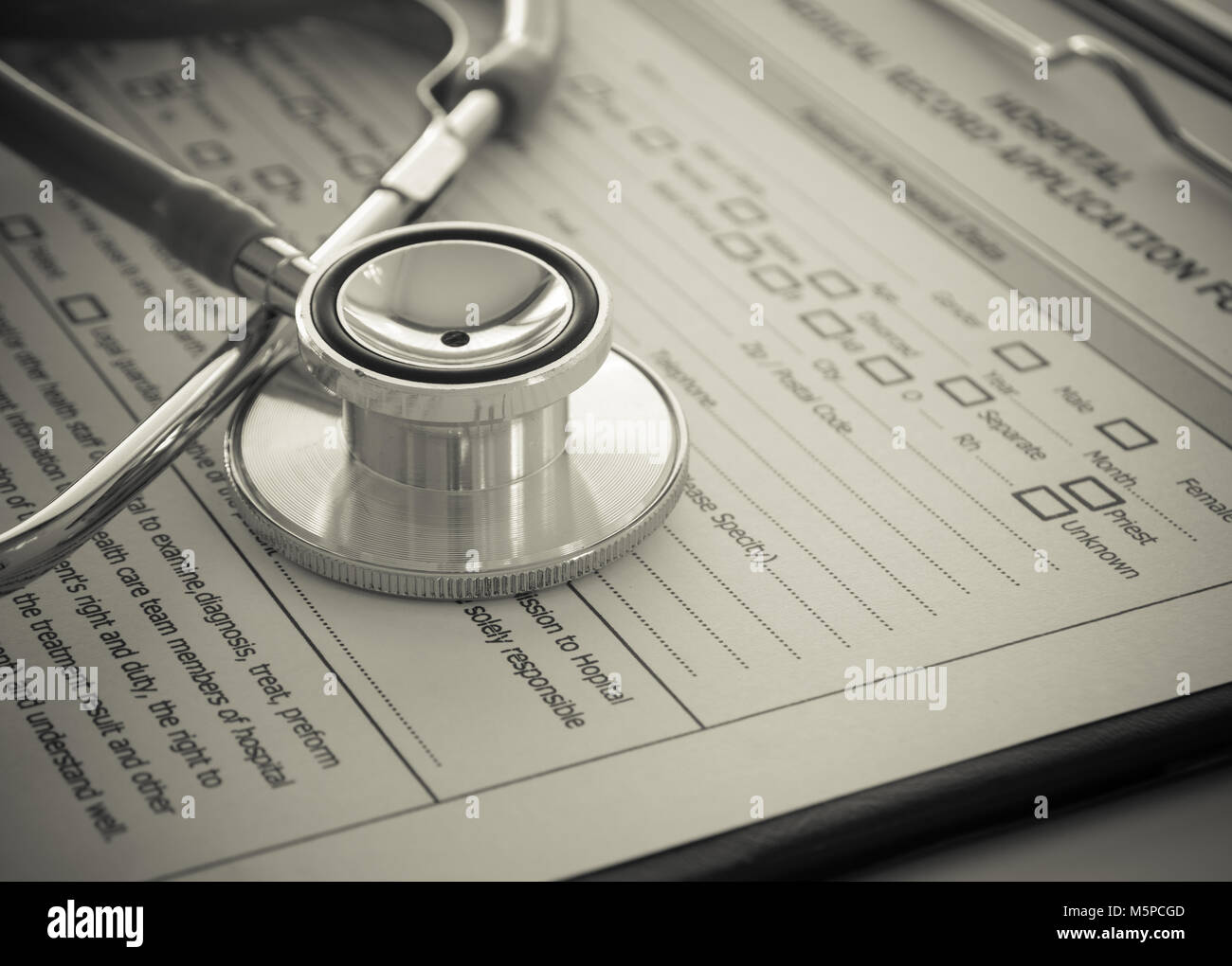 stethoscope-with-medical-record-application-form-on-physicians-desk