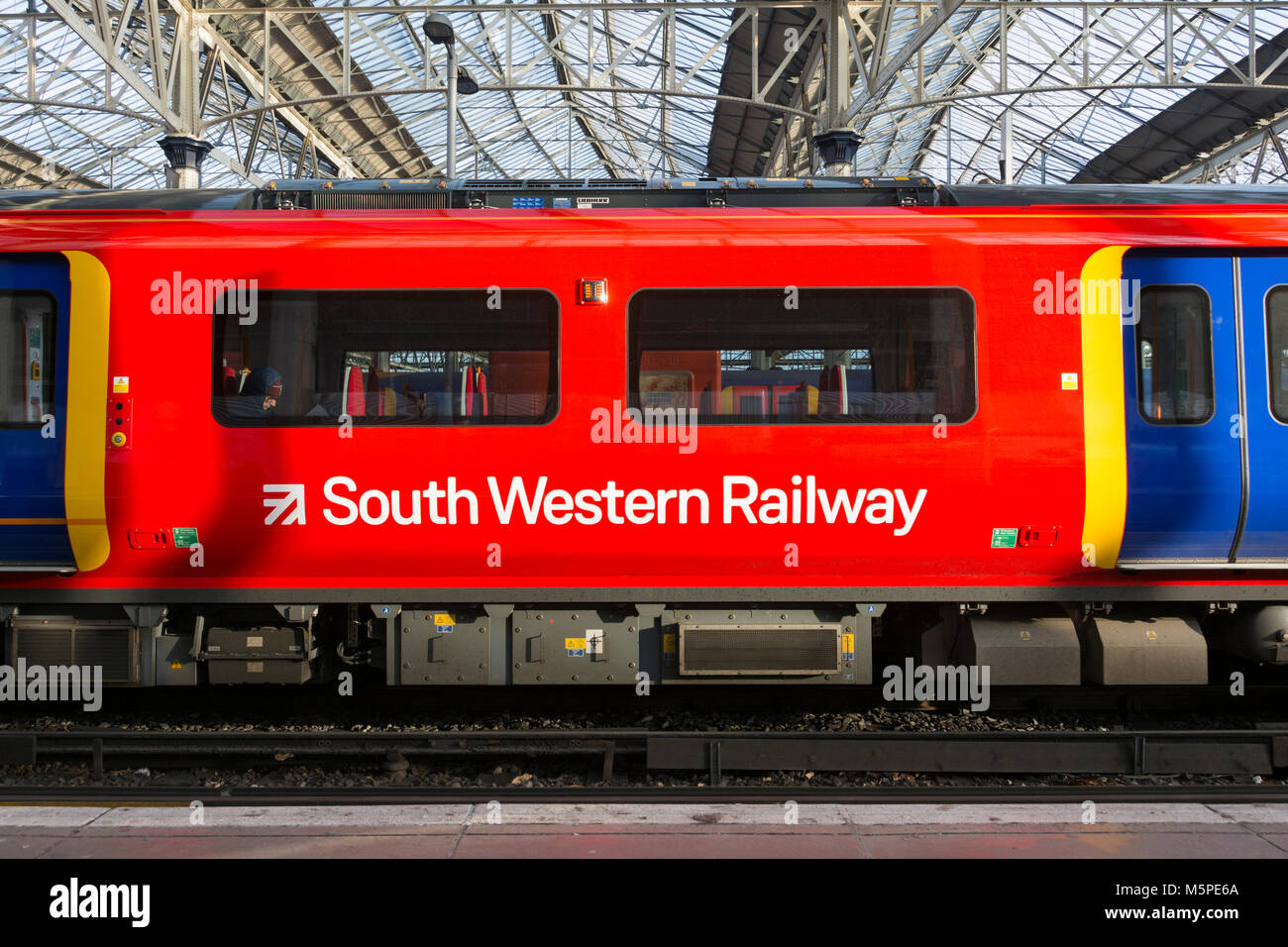 Closeup of a First Group/MTR South Western Railway Desiro City class 707 train, built by Siemens, waiting at Waterloo Station. Stock Photo