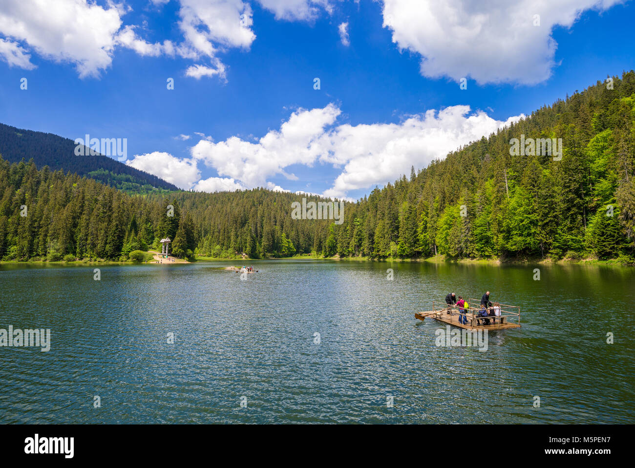 SYNEVIR, UKRAINE - JUNE 04, 2017: People using traditional raft on ...