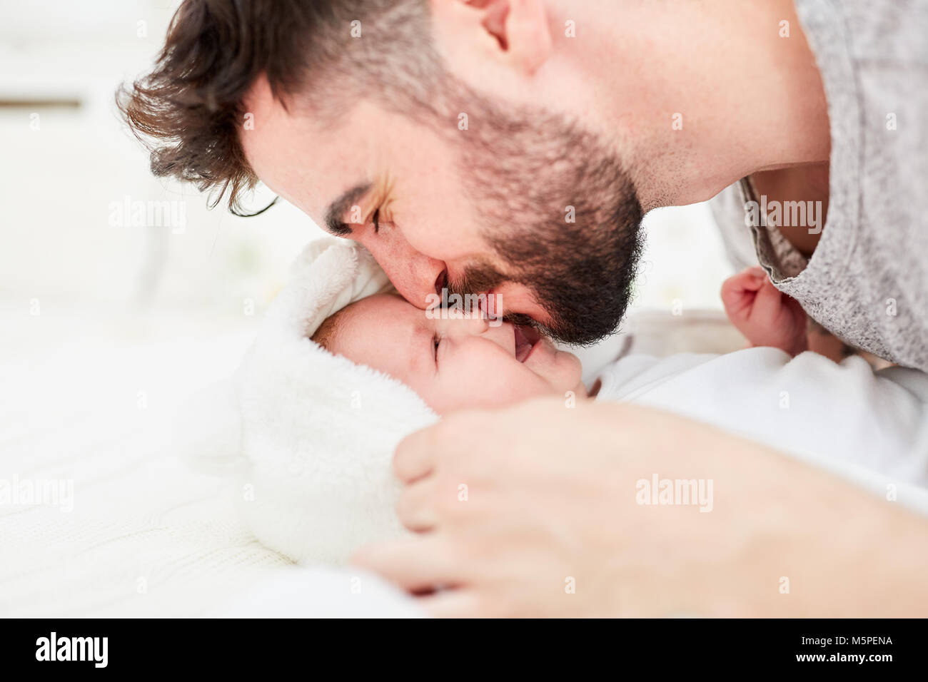 Son father forehead hi-res stock photography and images - Alamy
