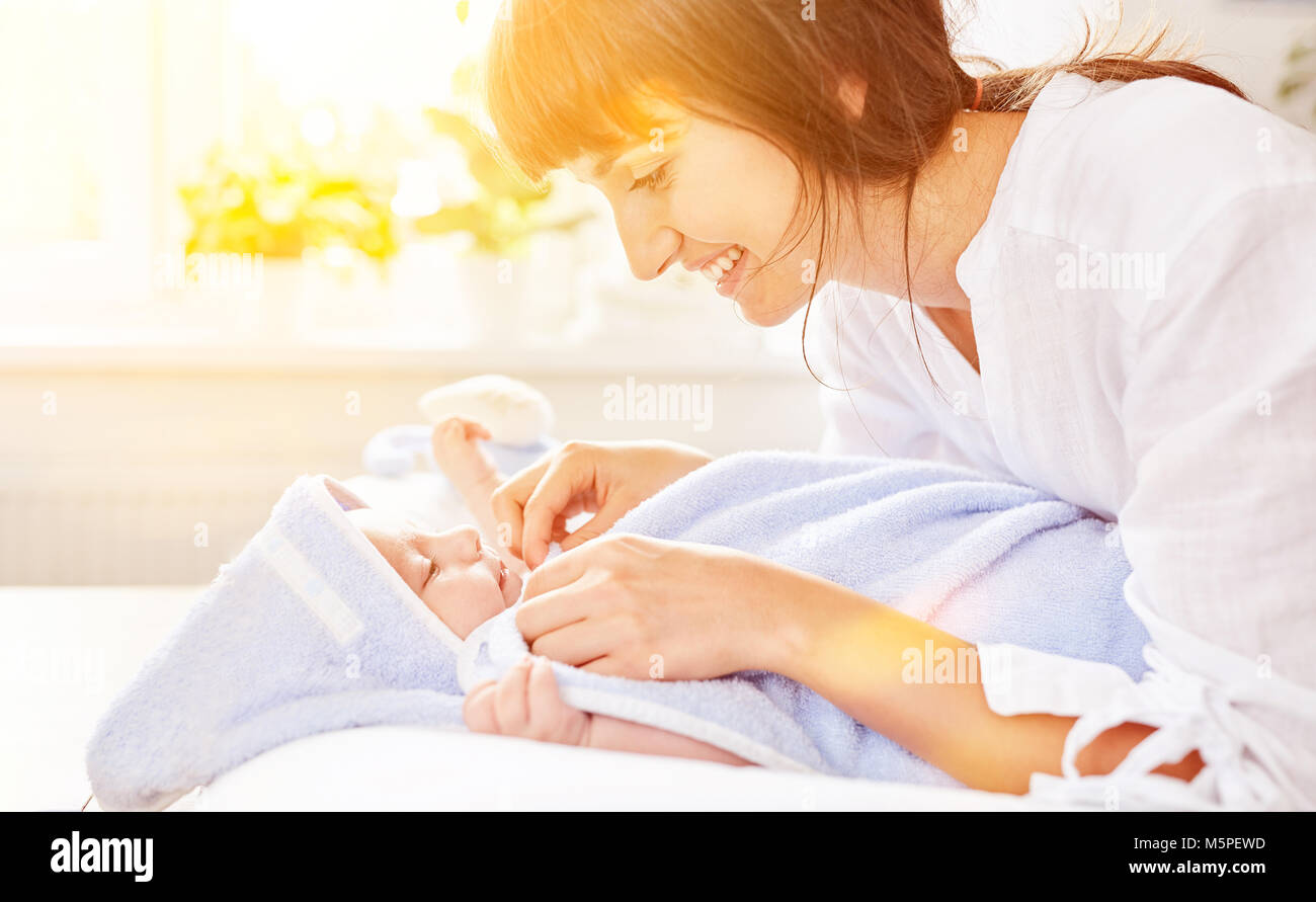 Mother drying her baby after bathing Stock Photo