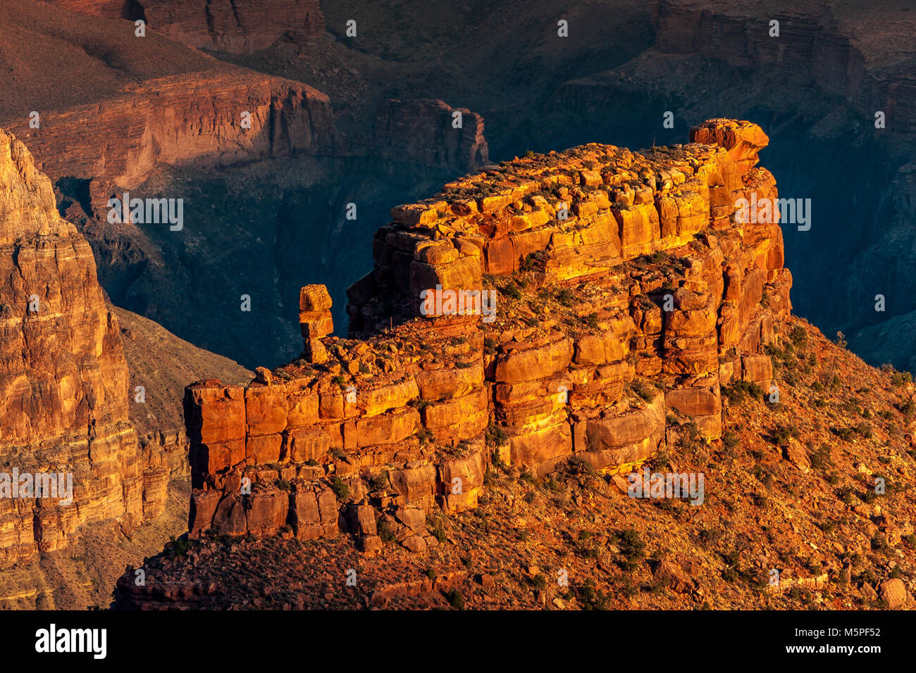 Sunrise at The Grand Canyon, the rising sun picks out interesting rock formations near Yaki Point at The Canyon's South Rim, Arizona ,USA Stock Photo