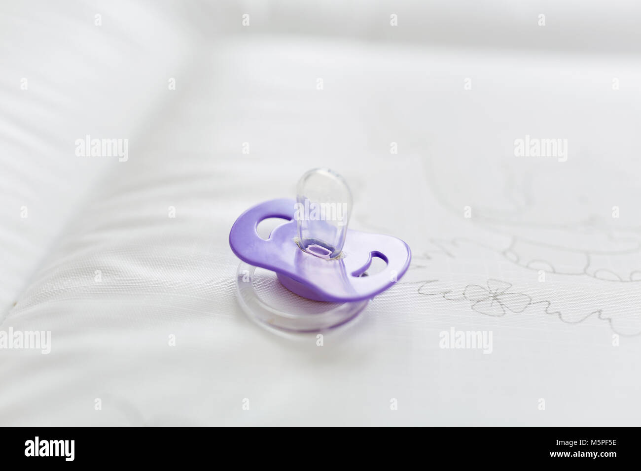 Pacifier as a soother and baby products Stock Photo