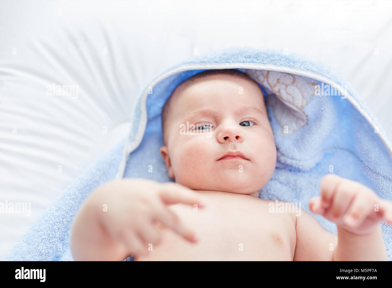 Newborn cute baby looks alert and awake Stock Photo