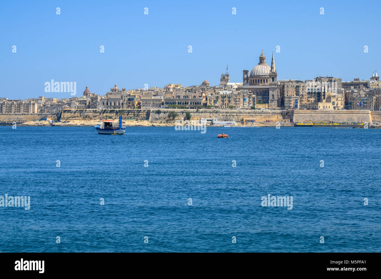 View of Valletta from Sliema, with the prominent dome of the Basilica of Our Lady of Mount Carmel, Valletta - Malta Stock Photo