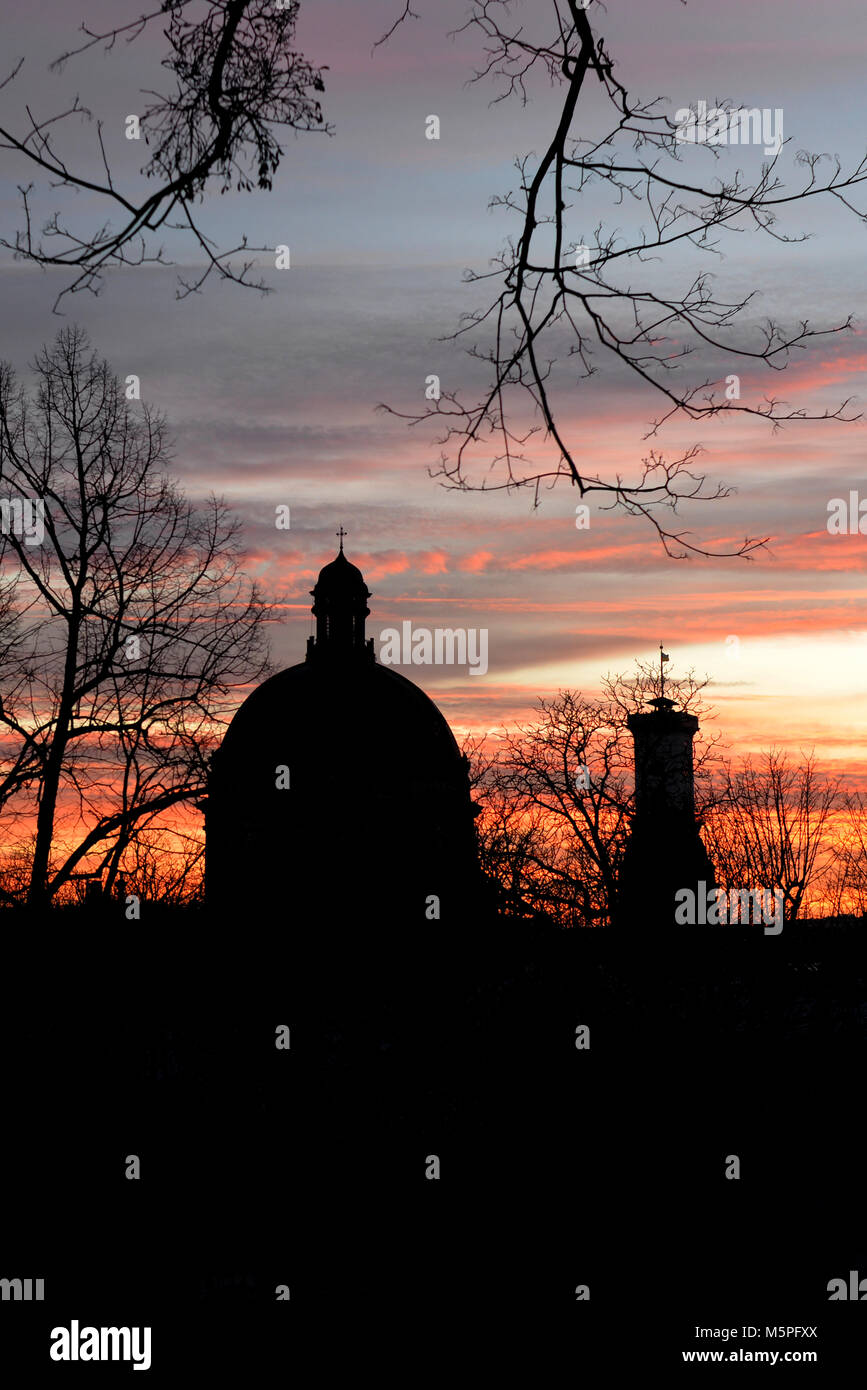 Church of the Blessed Eucharist (former Dominican convent church) and Lviv City Hall tower siluete at sunset, Lviv, Ukraine Stock Photo