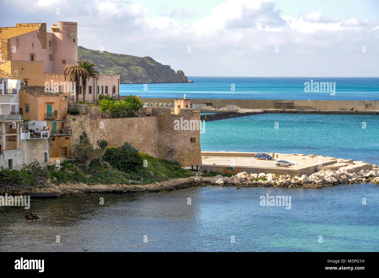 The castello in the  harbour of Castellammare del Golfo for which, the town is named after, Sicily, Italy. Stock Photo