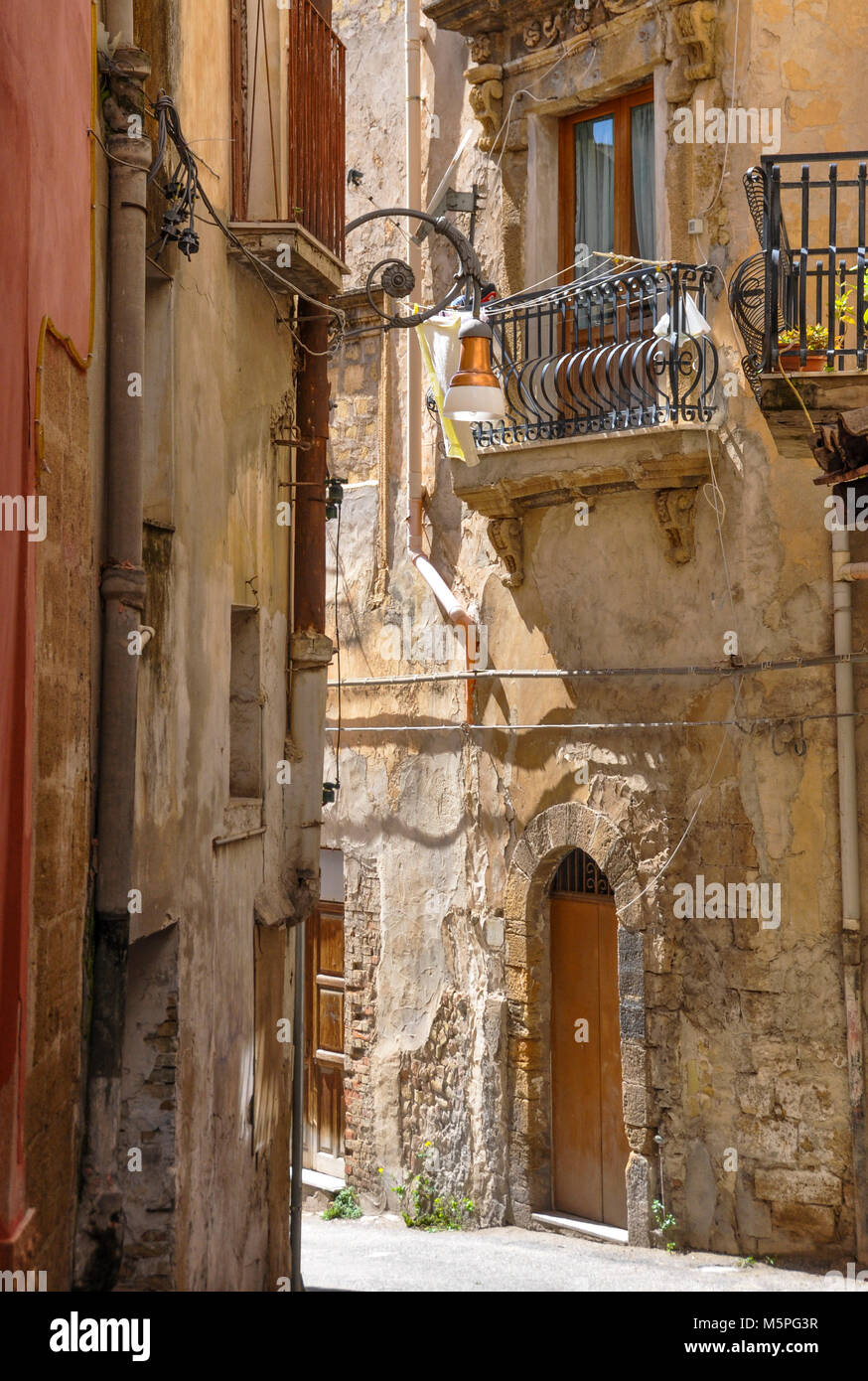 Rustic facade of  a balcony and dwelling in the town of Sciacca, Sicily, Italy. Stock Photo