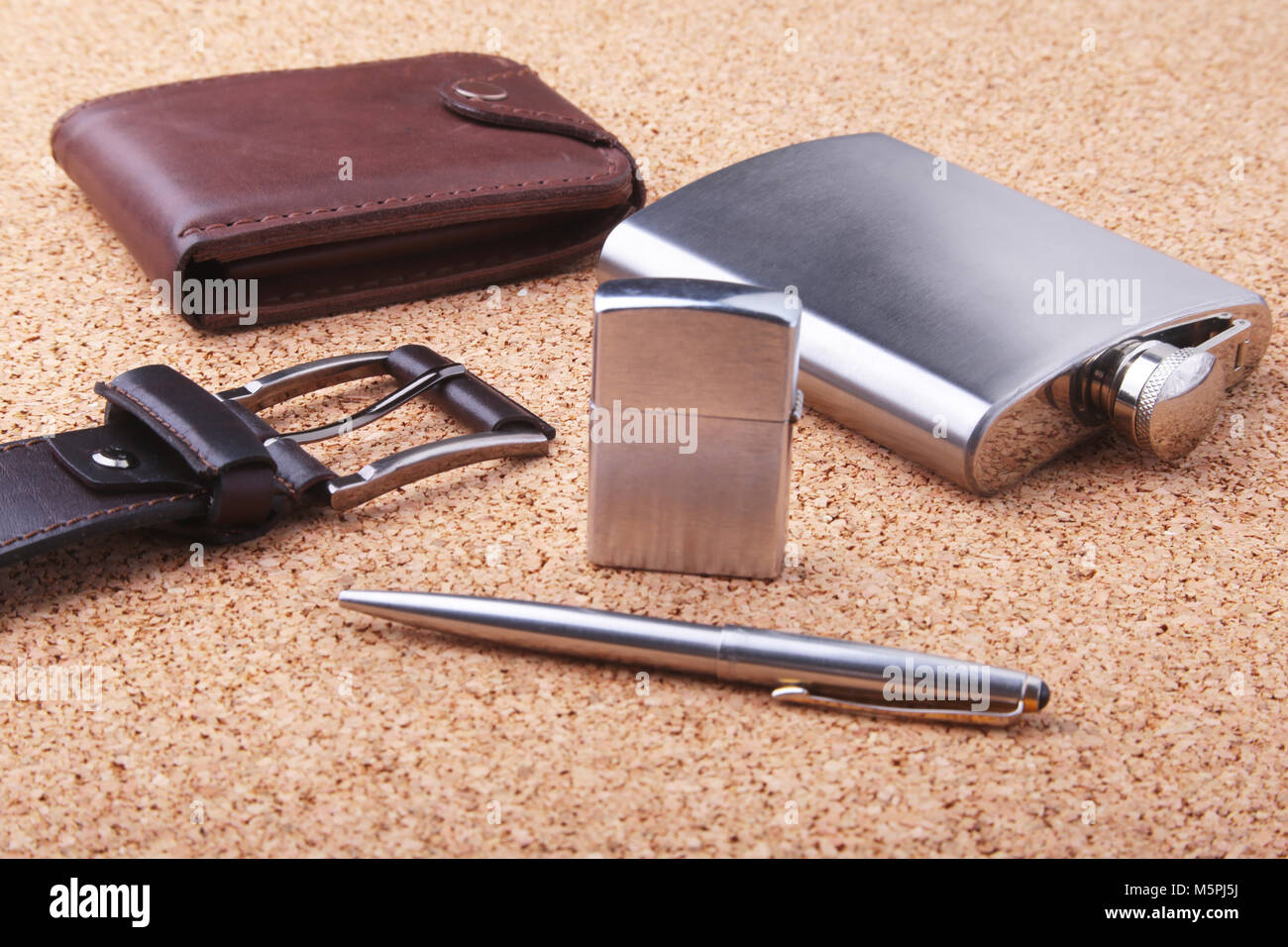 Gadgets and accessories for men on light wooden background. Fashionable men  s belt, wallet, lighter, Stainless hip flask and pen Stock Photo - Alamy