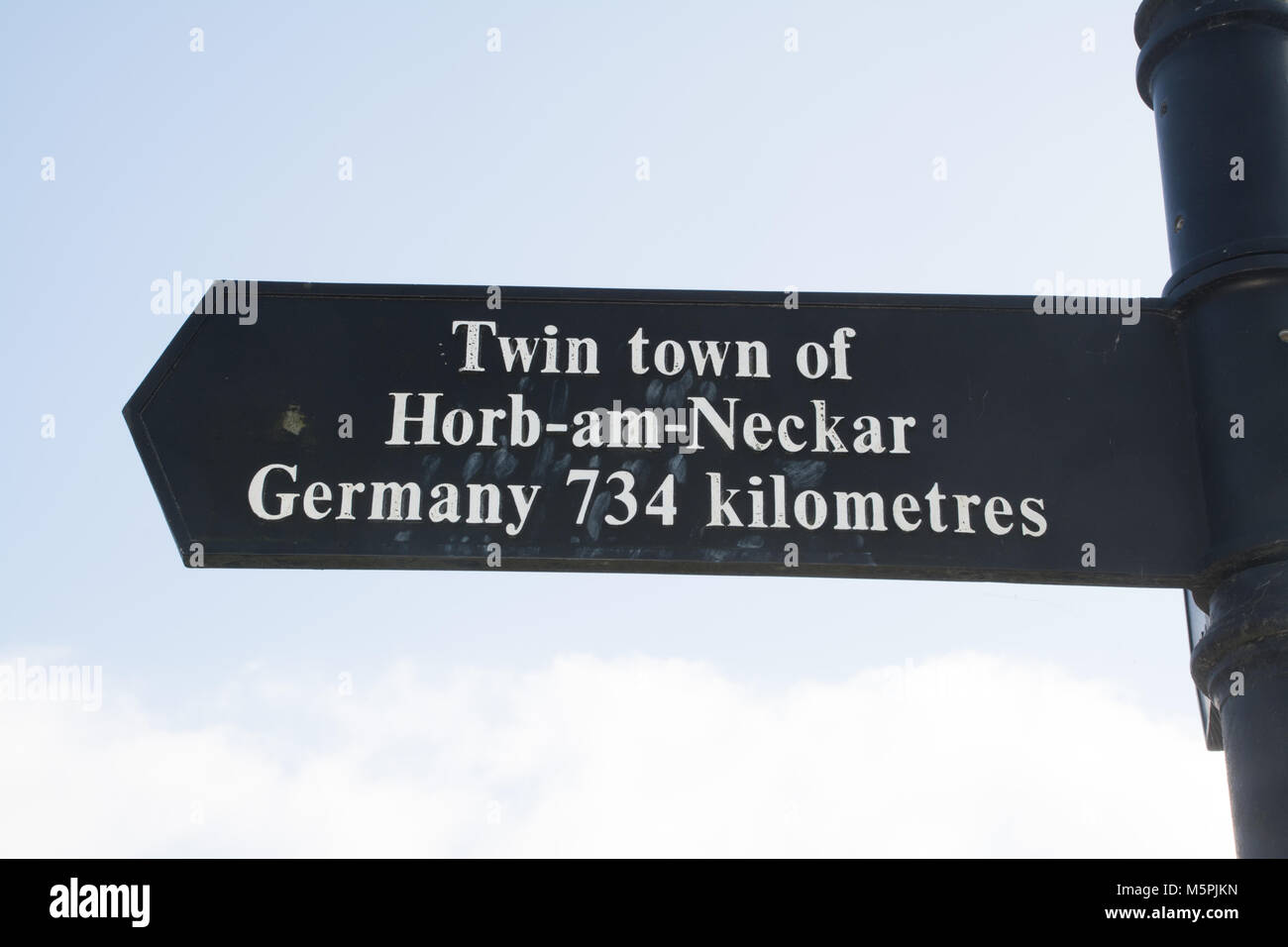 Sign in Haslemere town centre saying Twin town of Horb-am-Neckar Germany 734 kilometres Stock Photo