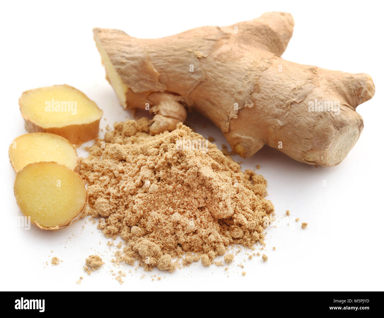 Ginger with dried powder over white background Stock Photo Alamy