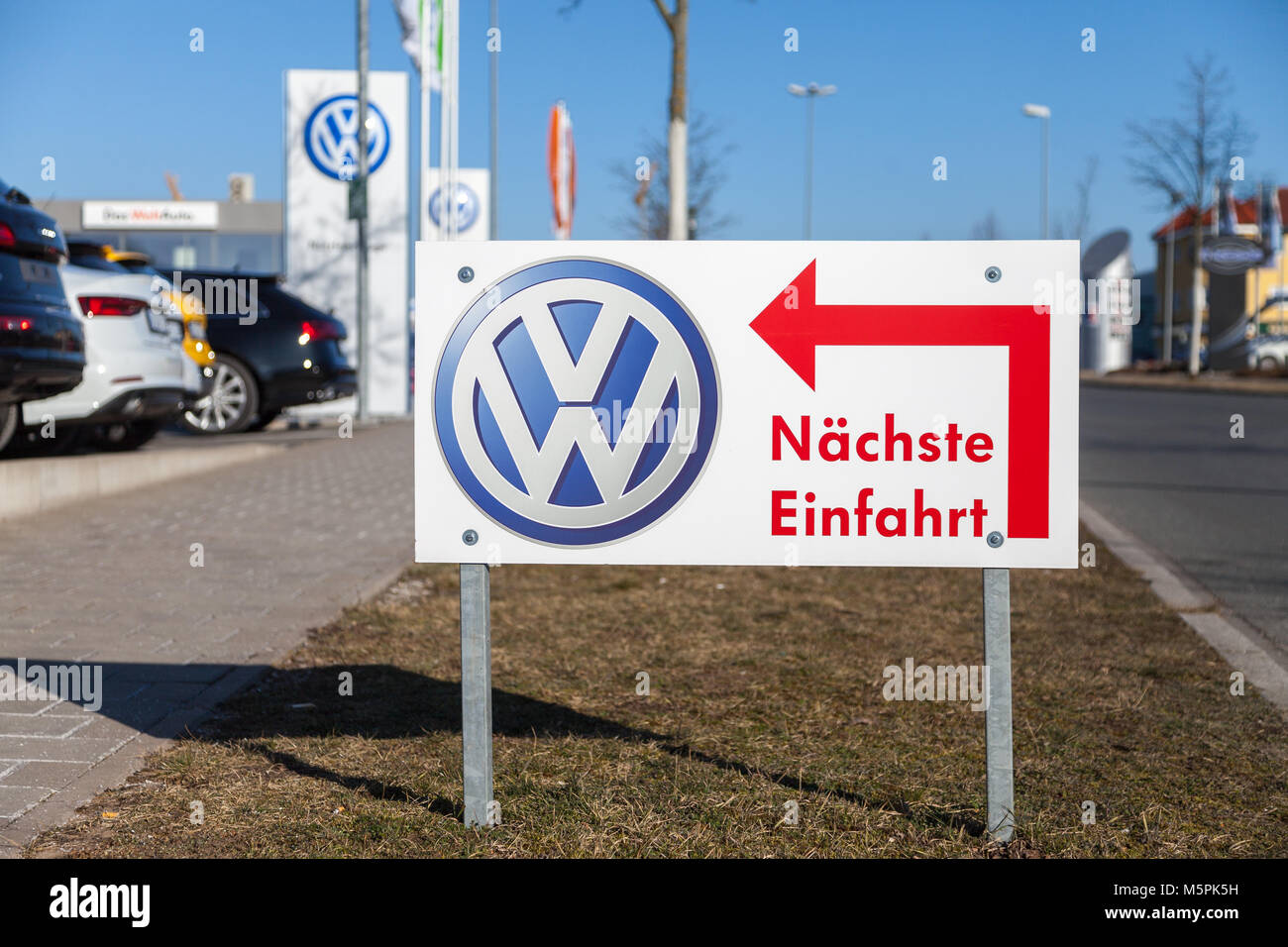 FUERTH / GERMANY - FEBRUARY 25, 2018: Volkswagen logo near a car dealer. Naechste Einfahrt means next entry. Volkswagen is a German automaker founded  Stock Photo