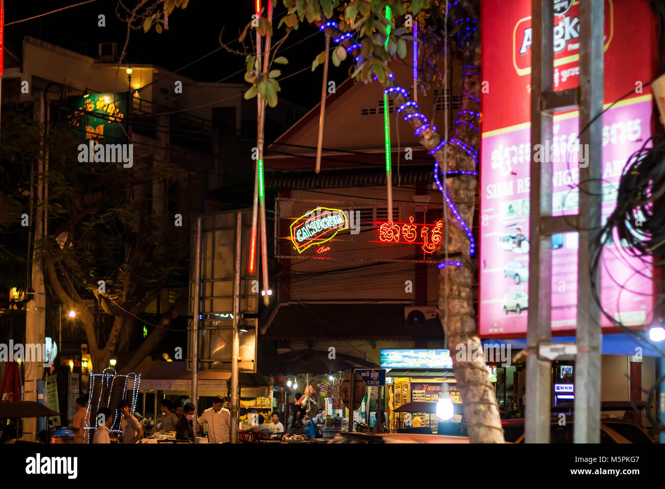 SIEM REAP, CAMBODIA- MARCH 22, 2013: Evening street in Siem Reap in Cambodia Stock Photo