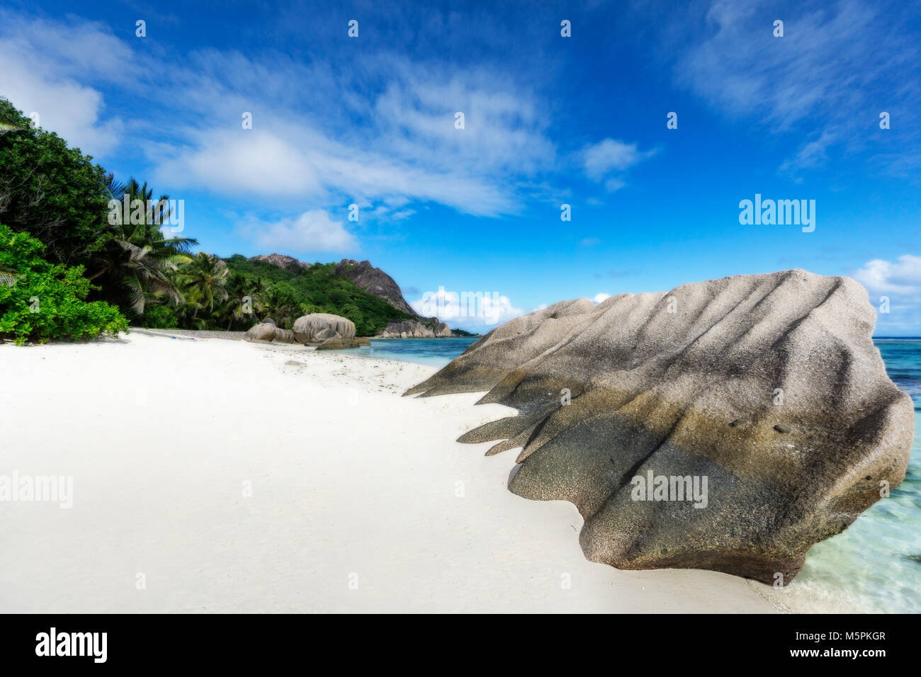 amazing picturesque paradise beach. granite rocks,white sand,palm trees