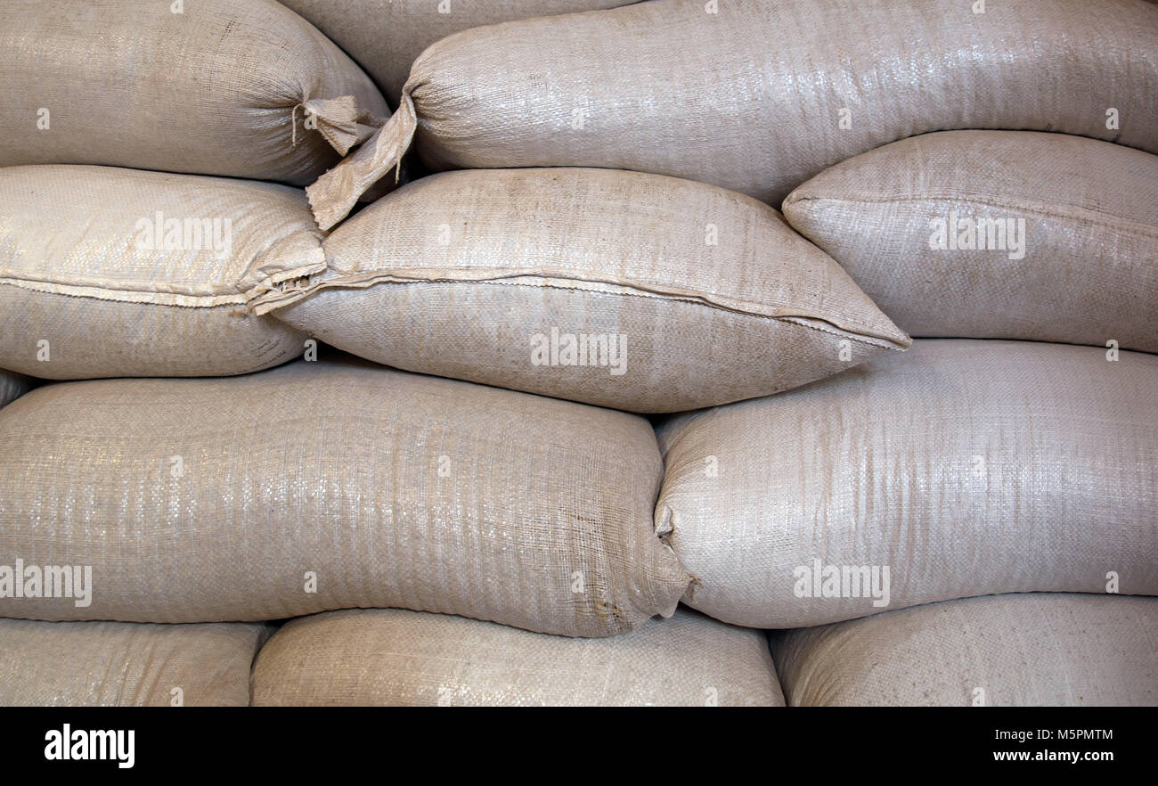 Industrial coffee bag pile closeup Stock Photo