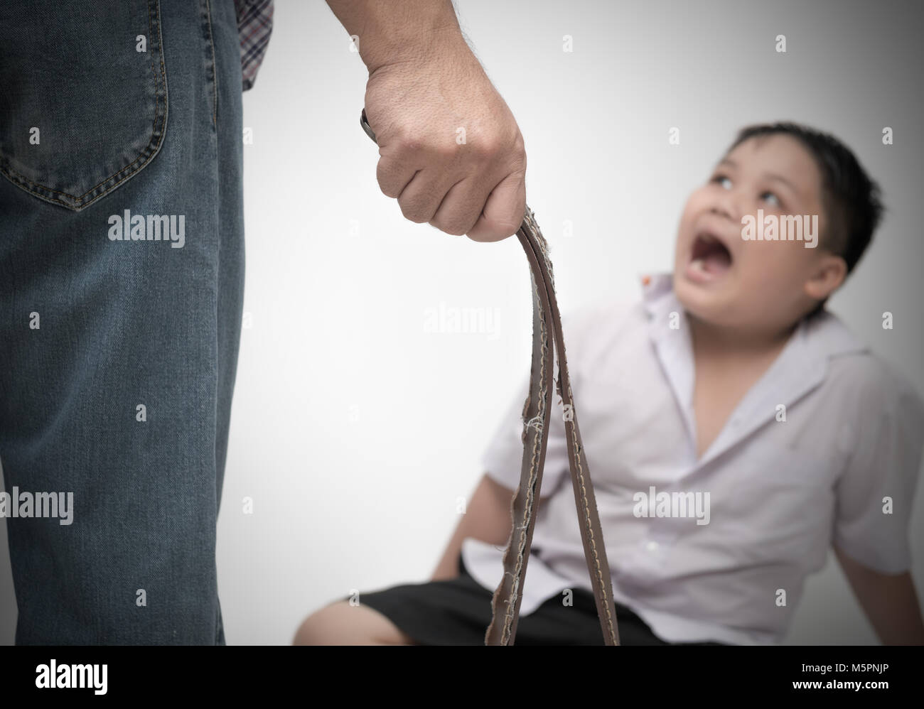 belt-in-father-hand-punish-son-because-he-do-not-do-homework-M5PNJP.jpg