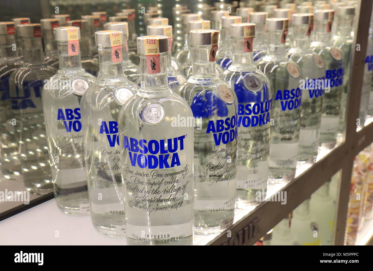 Duty free shop displays Absolut Vodka bottles at Kuala Lumpur International Airport in Malaysia Stock Photo