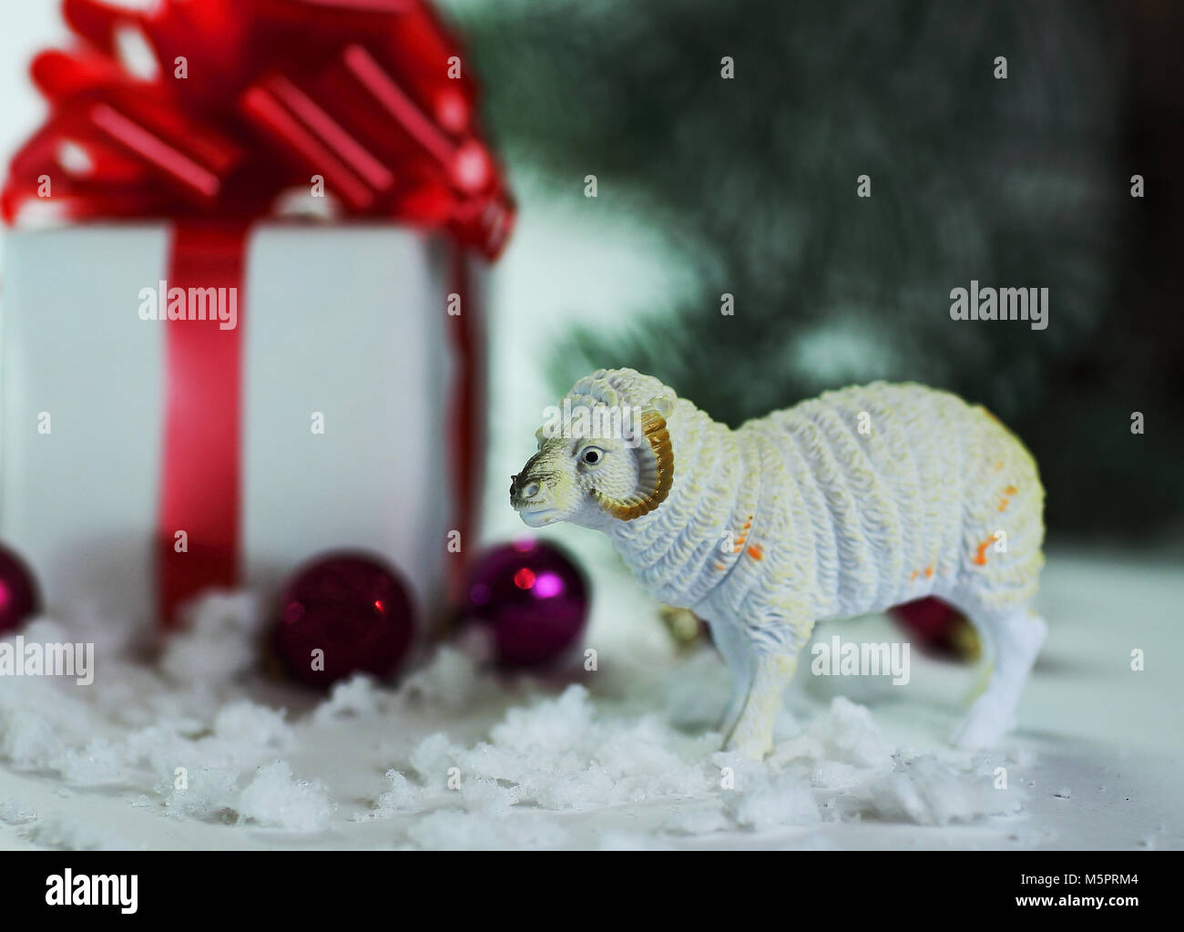 toy sheep and boxes with gifts on Christmas background Stock Photo Alamy