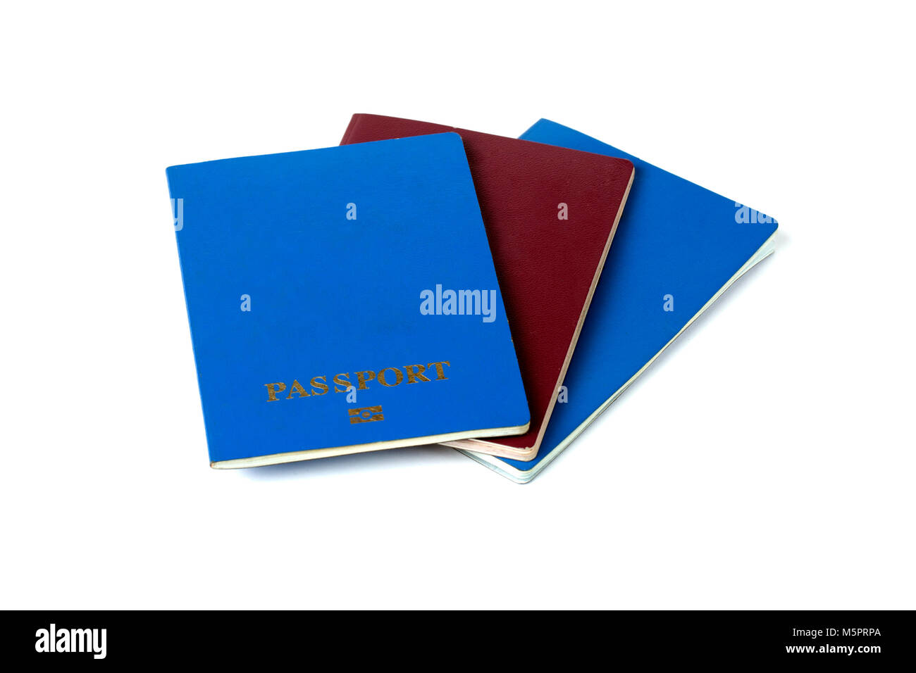 three passports of different colors, on white background Stock Photo