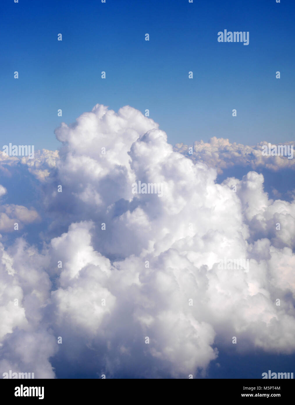 Aerial view of white clouds on clear blue sky Stock Photo - Alamy