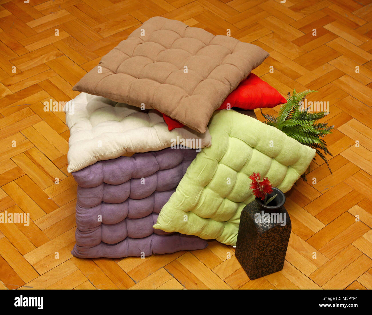 Big pile of colorful kitchen chair pillows Stock Photo Alamy