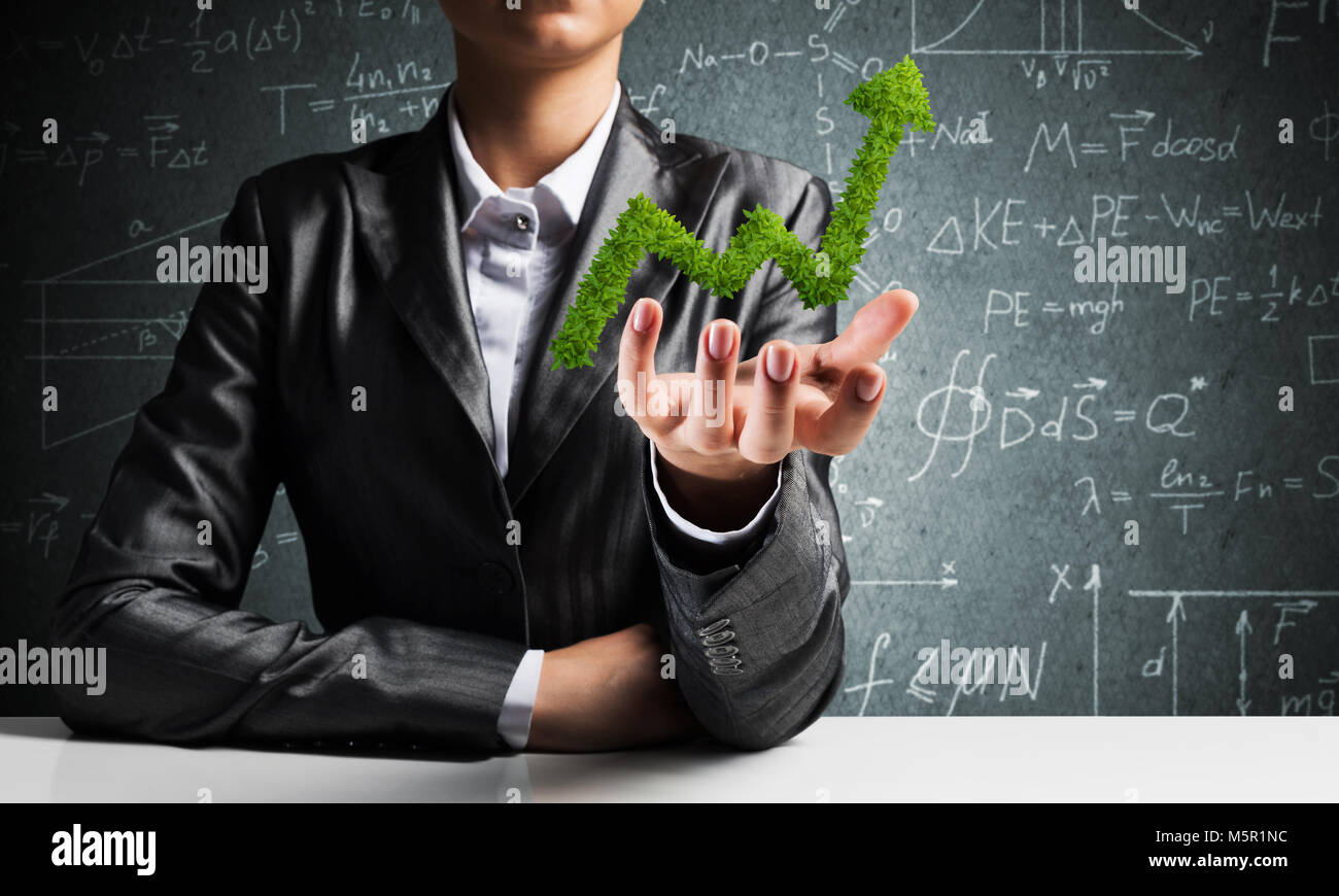 Businessman presenting growing graph Stock Photo - Alamy