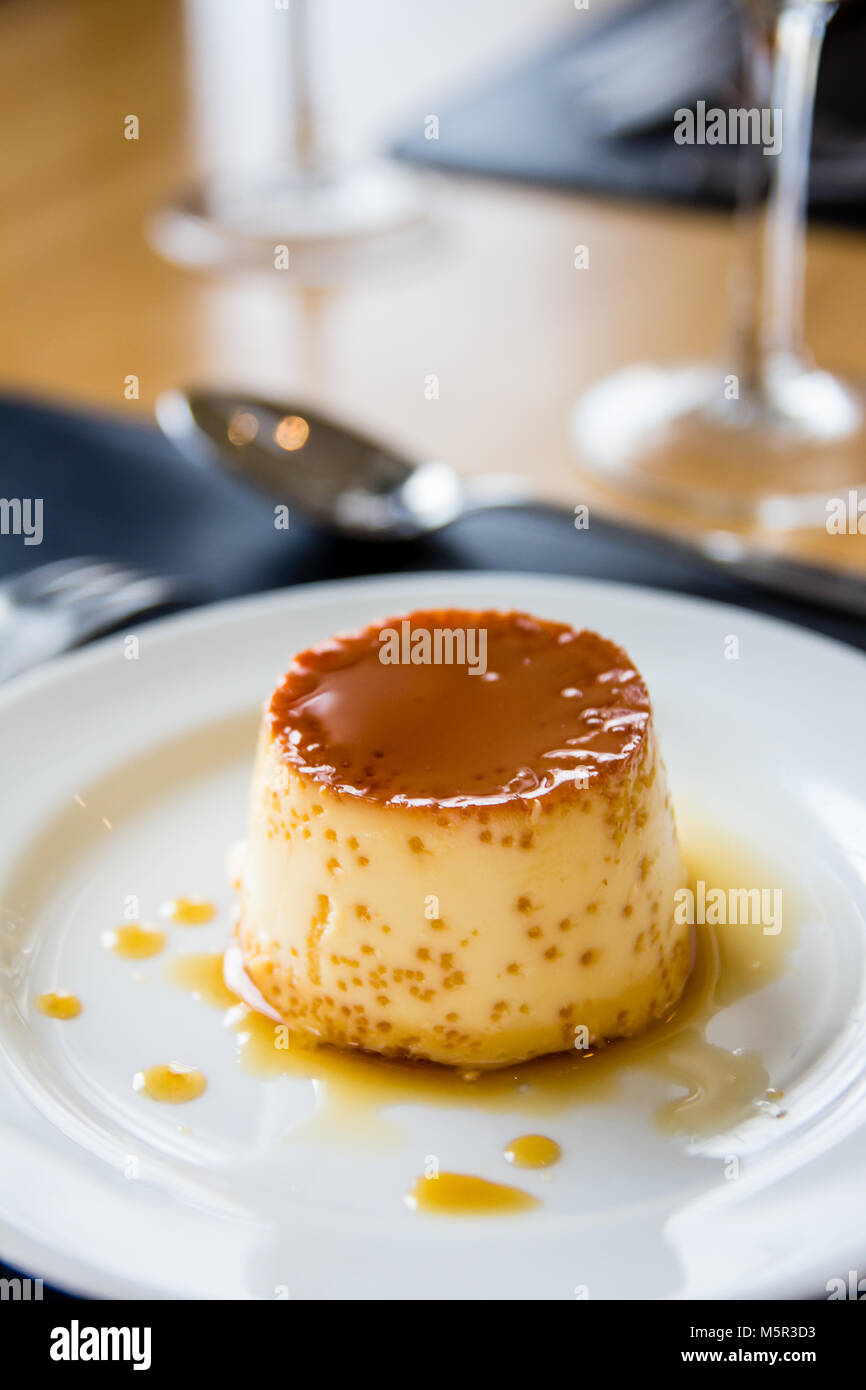 https://c8.alamy.com/comp/M5R3D3/milk-pudding-on-white-plate-caramel-dropplets-M5R3D3.jpg