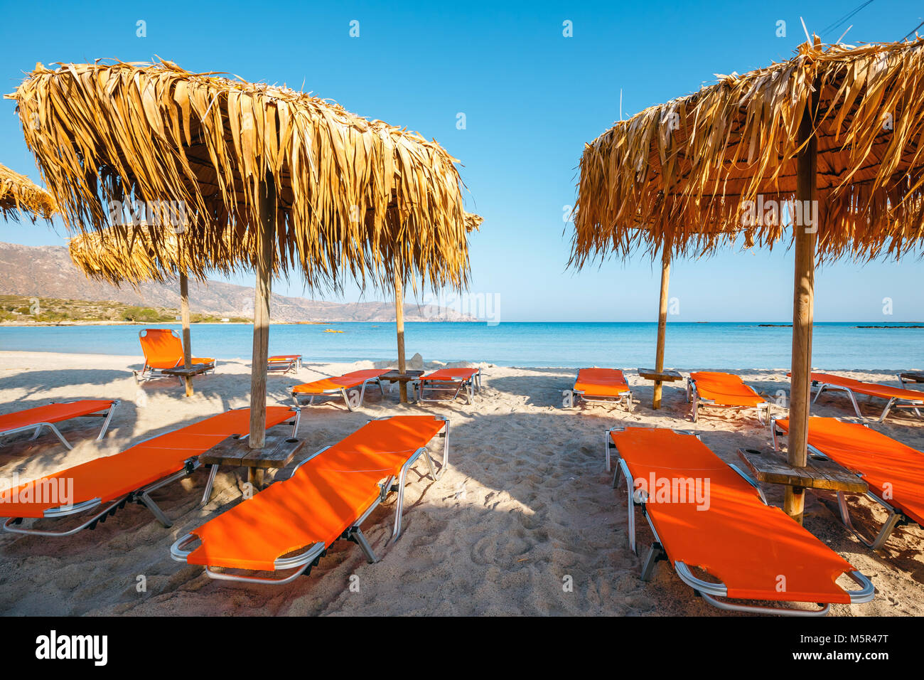 Umbrellas on the Elafonissi beach on Crete Island, Greece Stock Photo