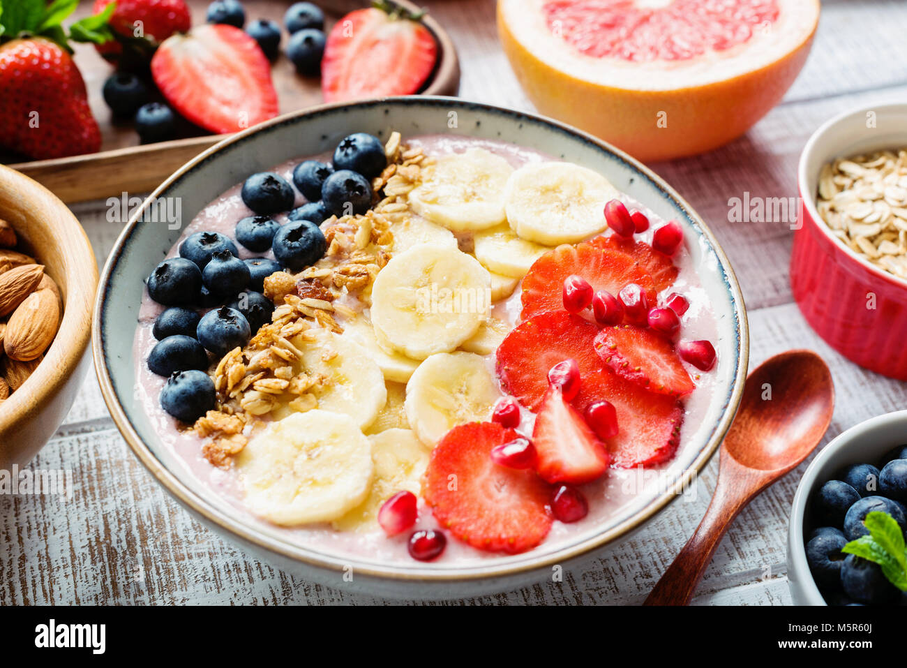 Acai smoothie bowl with banana, strawberry, blueberry and granola