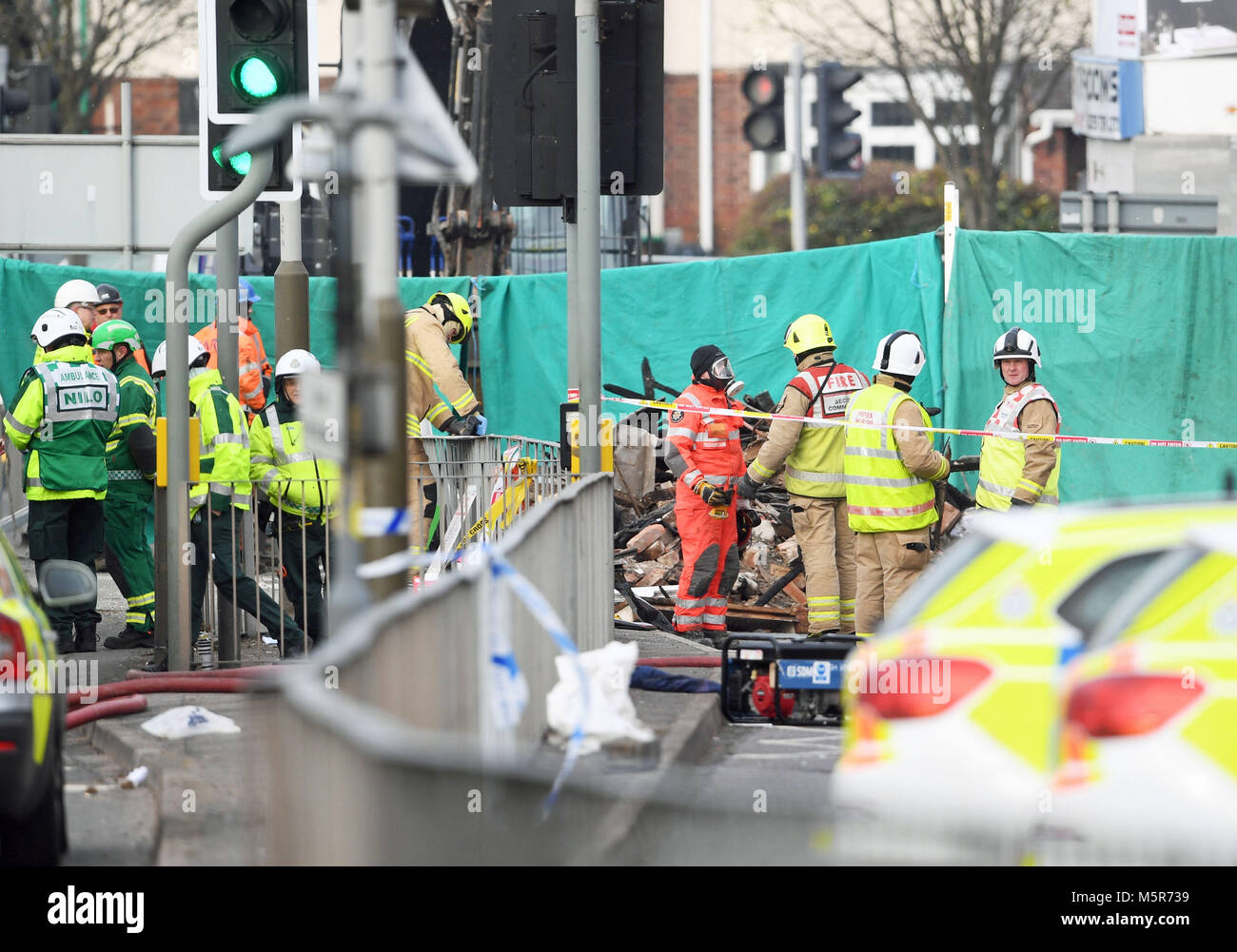 Emergency personnel continue to work at the scene on Hinckley Road in Leicester, as four people were killed, after a suspected explosion and subsequent fire destroyed a shop. Stock Photo