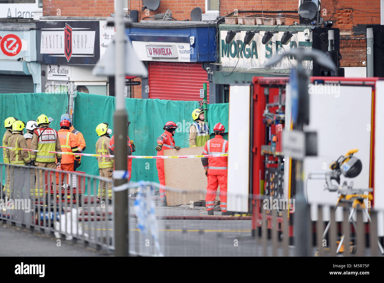 Emergency personnel continue to work at the scene on Hinckley Road in Leicester, as four people were killed, after a suspected explosion and subsequent fire destroyed a shop. Stock Photo