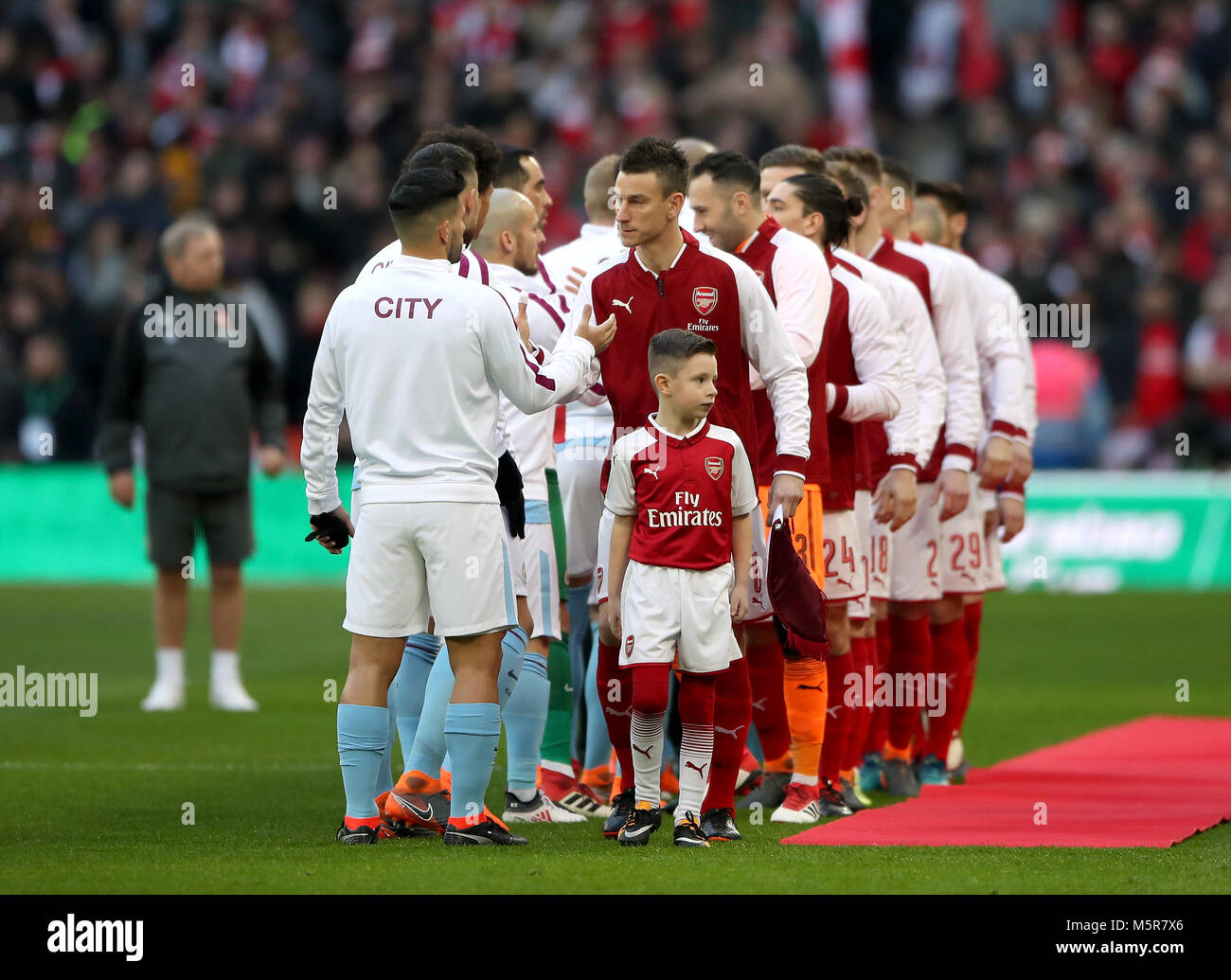 The two team's shake hands before the Carabao Cup Final at Wembley Stadium, London. PRESS ASSOCIATION Photo. Picture date: Sunday February 25, 2018. See PA story SOCCER Final. Photo credit should read: Nick Potts/PA Wire. RESTRICTIONS: No use with unauthorised audio, video, data, fixture lists, club/league logos or 'live' services. Online in-match use limited to 75 images, no video emulation. No use in betting, games or single club/league/player publications. Stock Photo