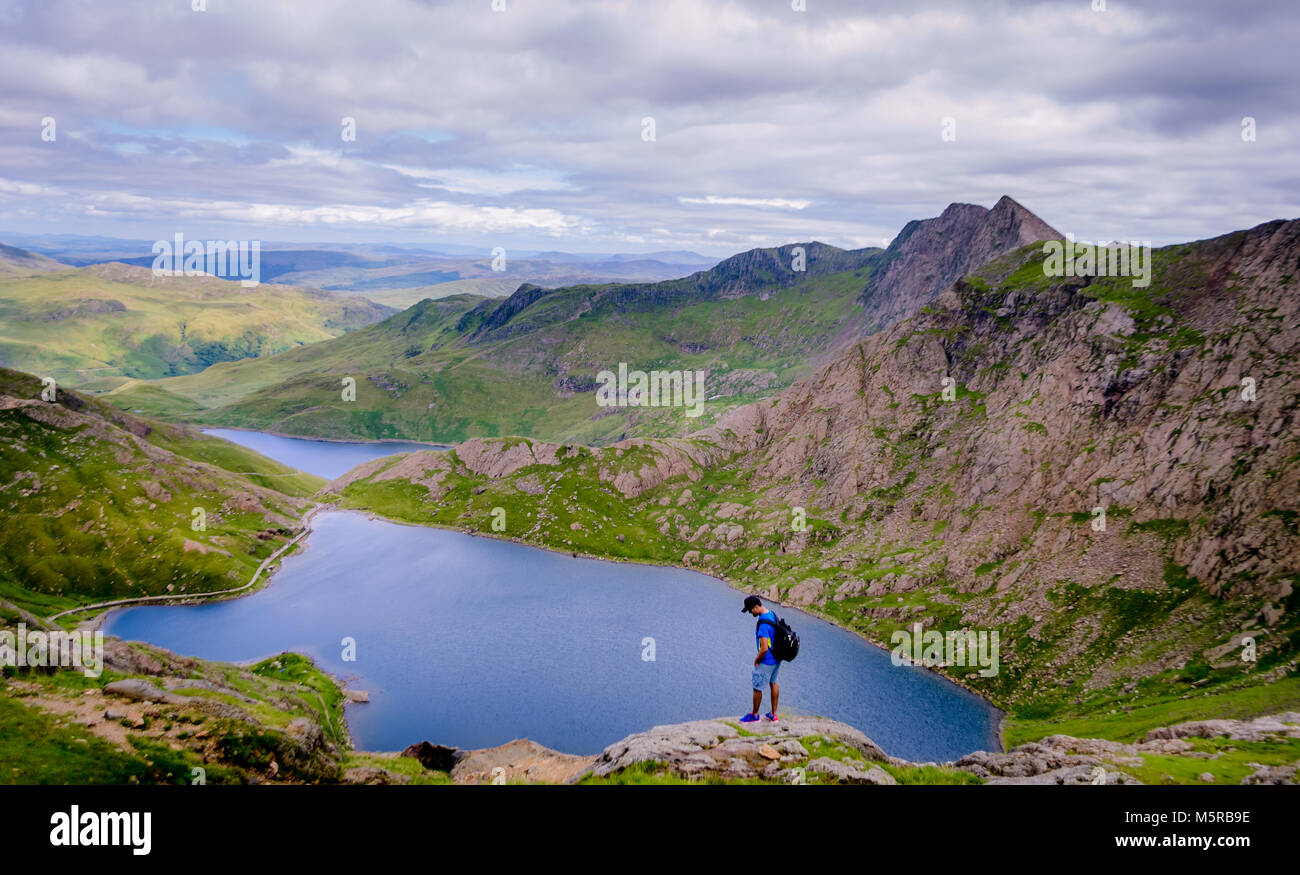 Stand and absorb the nature that surrounds you - Taken during the Snowdon summit hike in Wales UK during summers Stock Photo