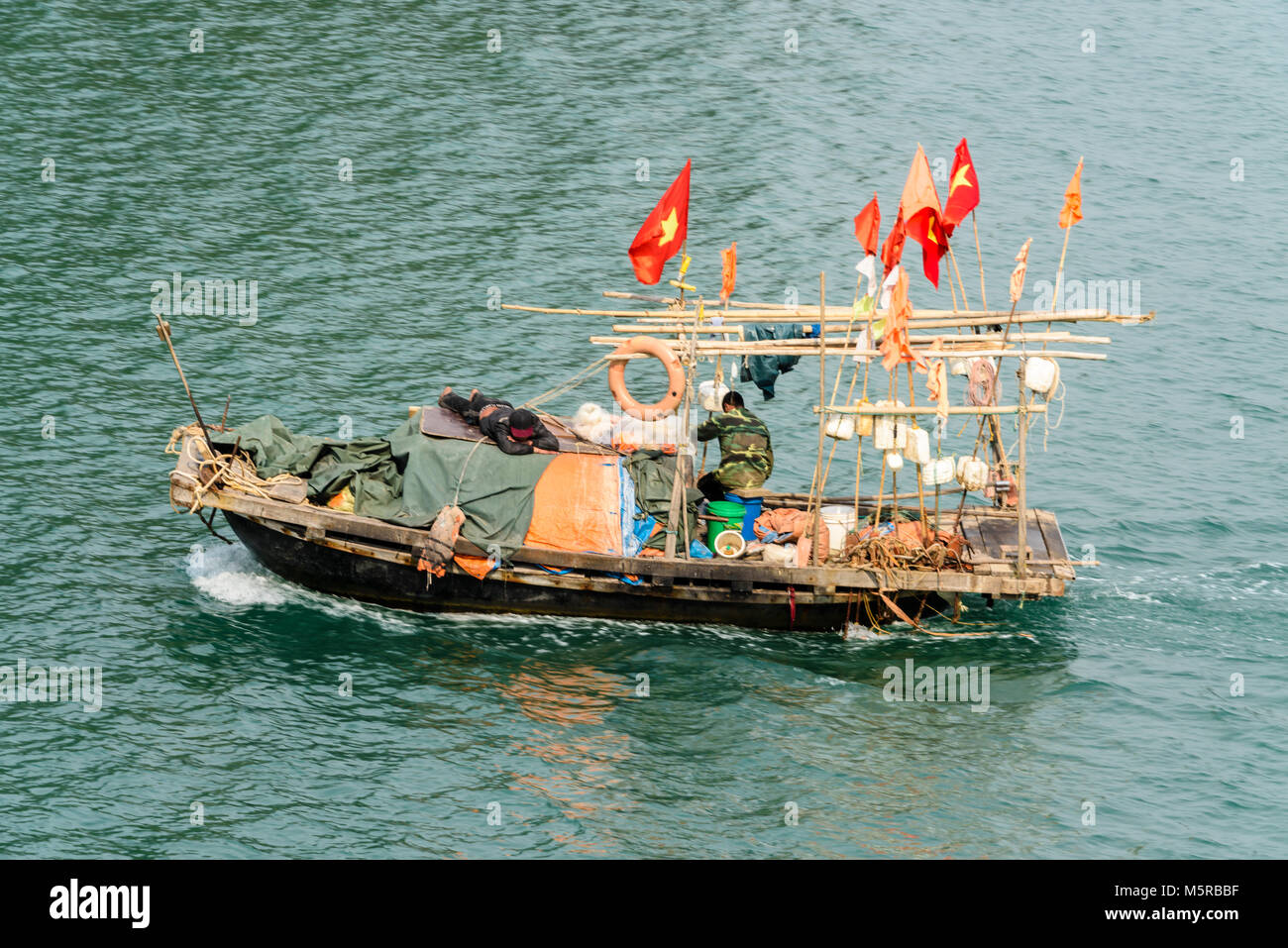 Traditional fishing boat on Halong Bay, Vietnam Stock Photo