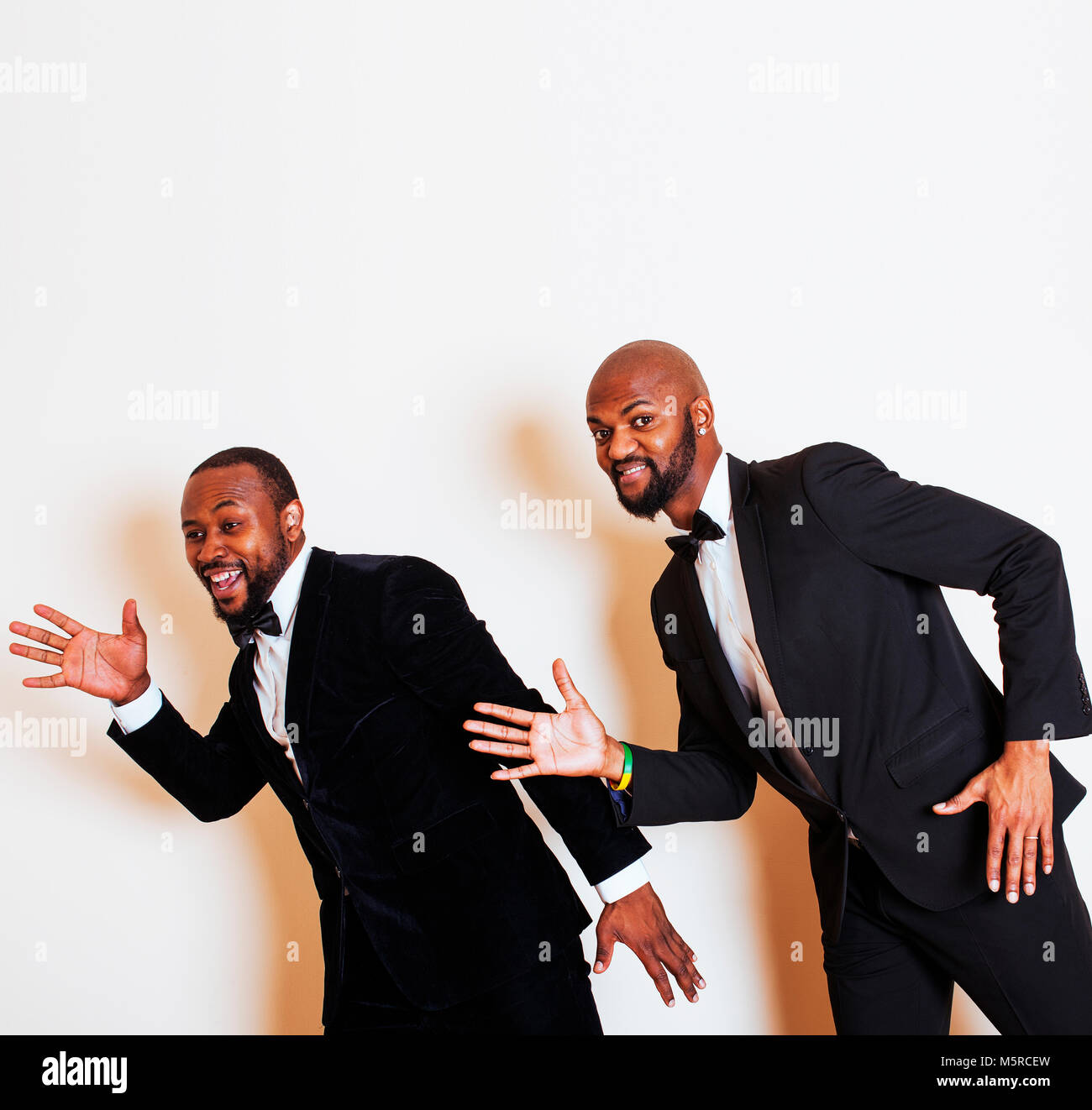 two afro-american businessmen in black suits emotional posing, g Stock ...