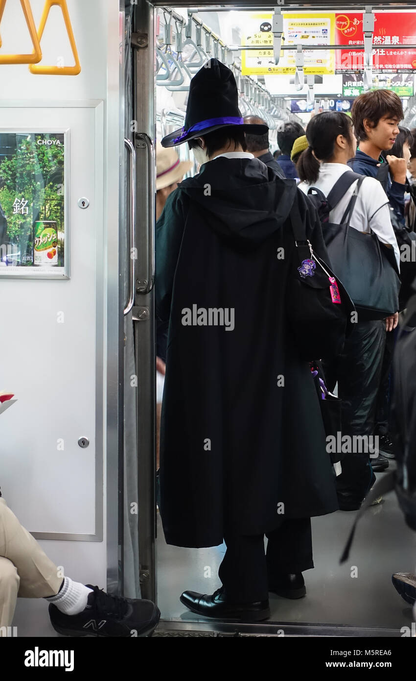 Man in Wizard Costume Riding the Tokyo Metro Stock Photo