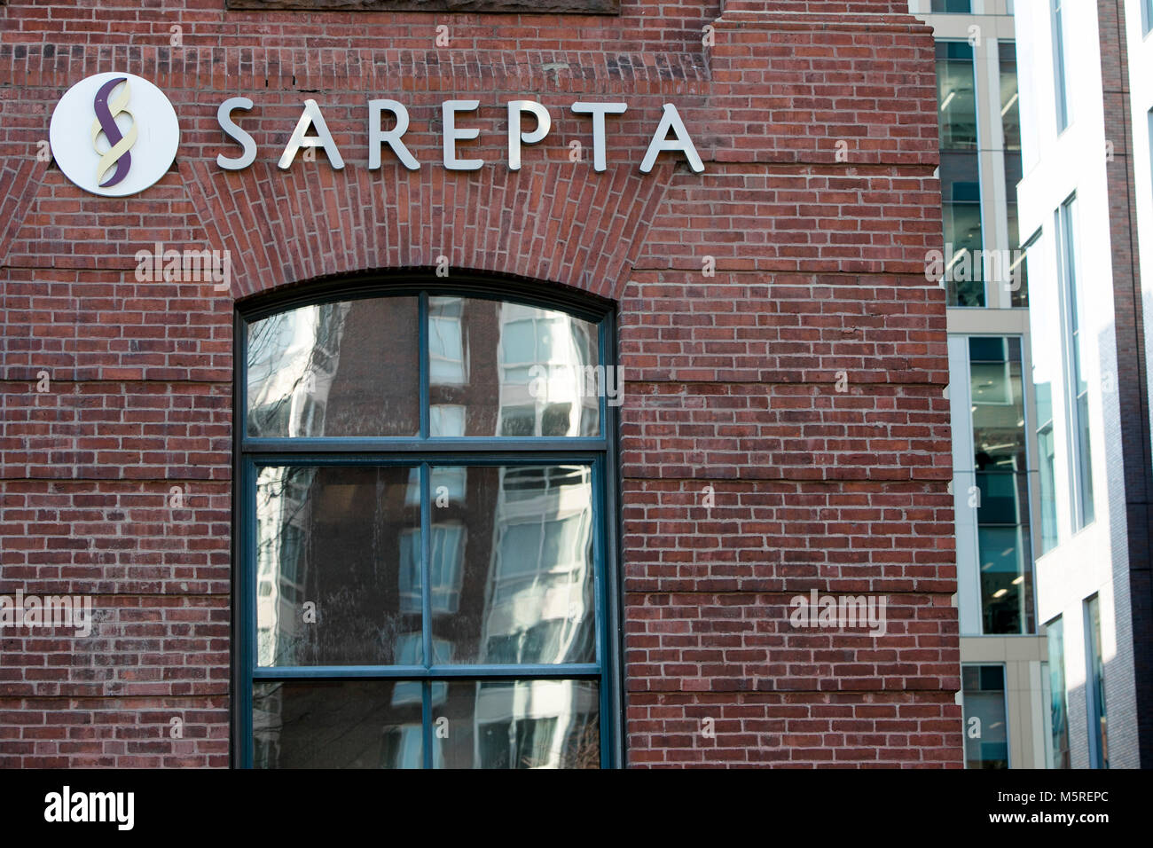 A logo sign outside of the headquarters of Sarepta Therapeutics, Inc