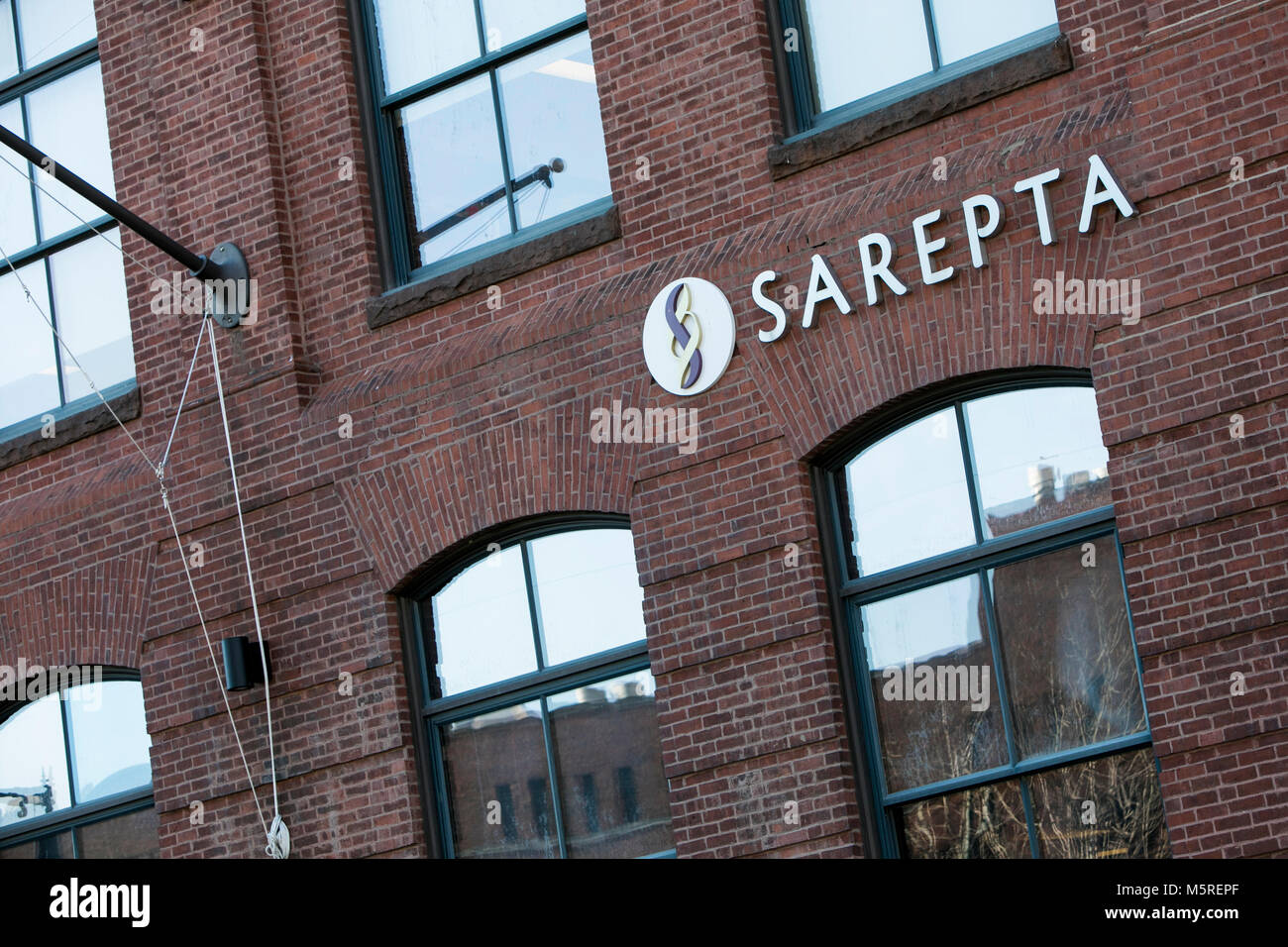 A logo sign outside of the headquarters of Sarepta Therapeutics, Inc
