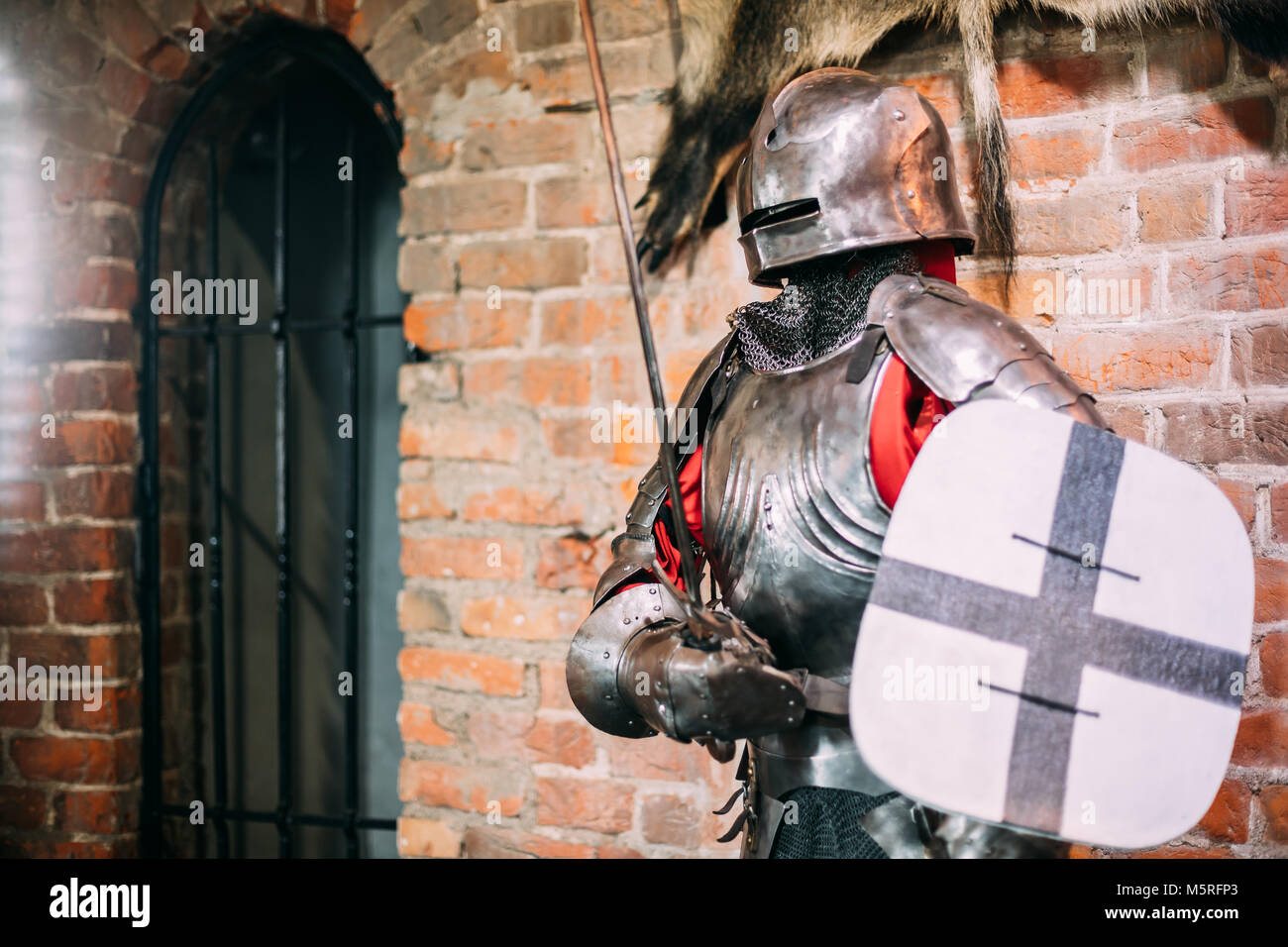 Kamyenyets, Brest Region, Belarus. Full Military Armor Of Knight Warriors Of Western Europe Of 14th Century In Museum Inside Tower Of Kamyenyets. Stock Photo