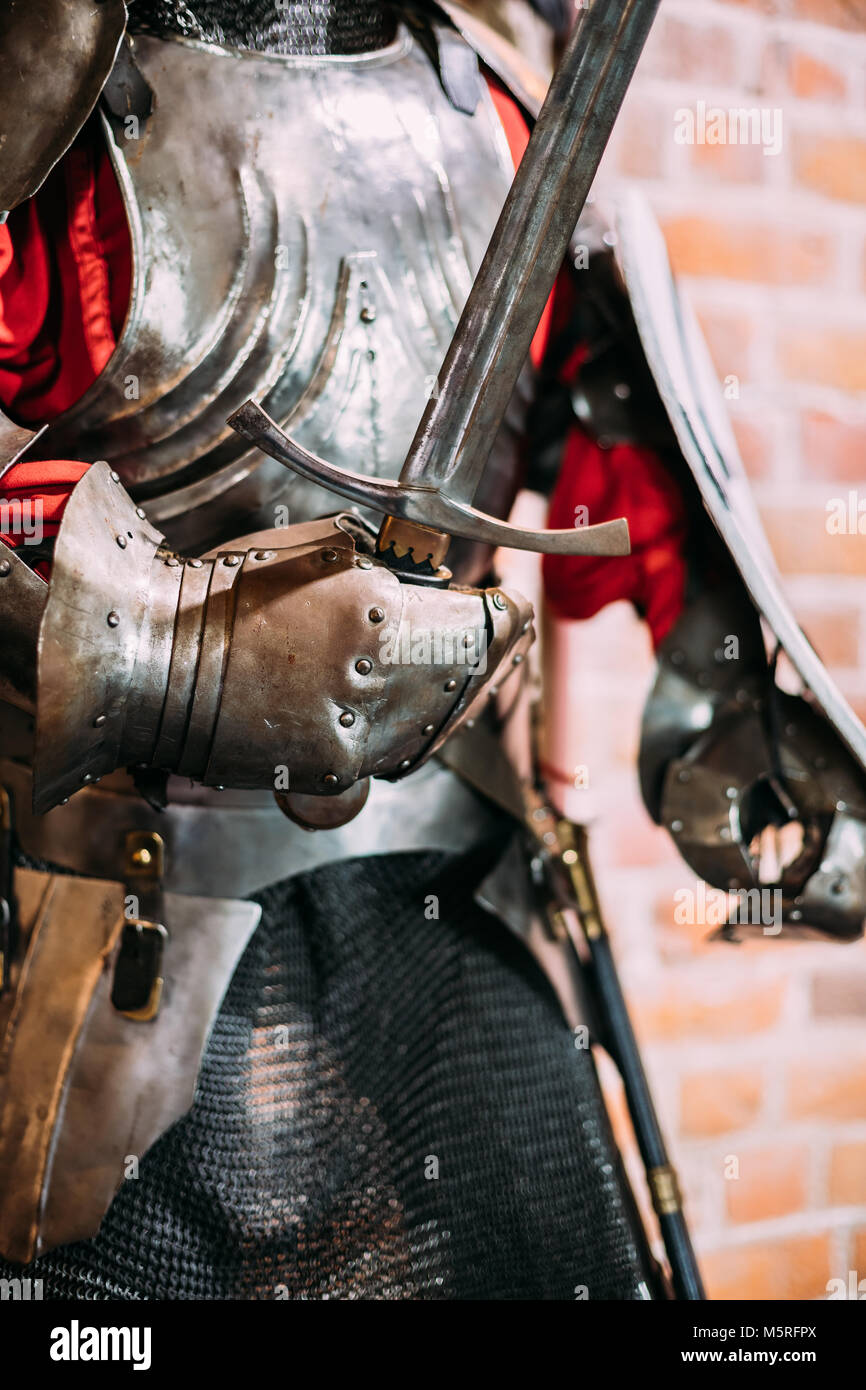 Kamyenyets, Brest Region, Belarus. Full Military Armor Of Knight Warriors Of Western Europe Of 14th Century In Museum Inside Tower Of Kamyenyets. Stock Photo