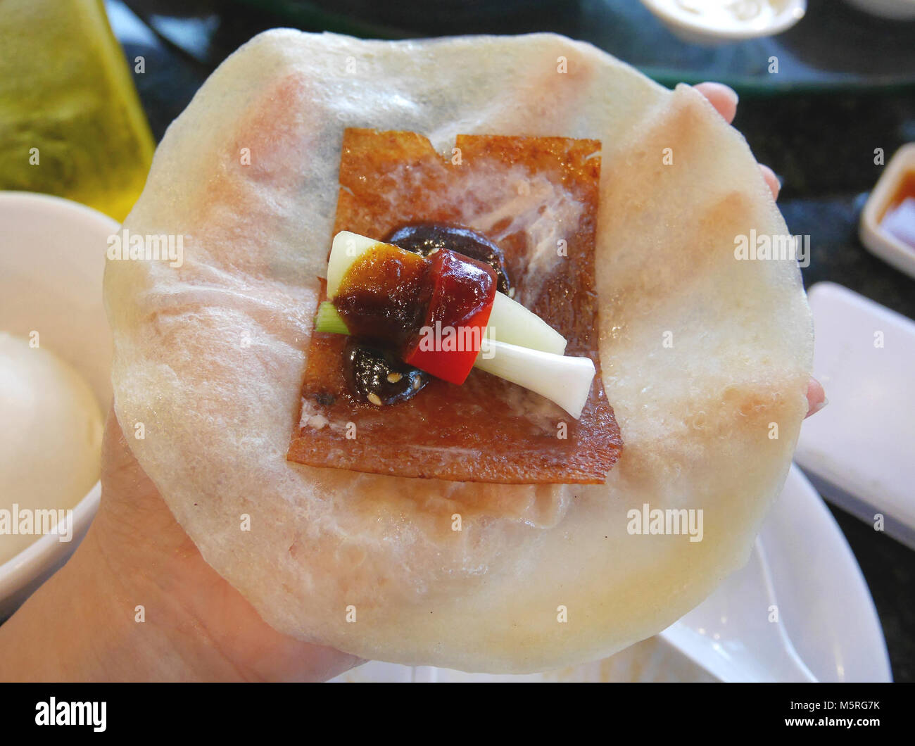 Peking duck dish, including peking duck's crispy roasted skin, spring