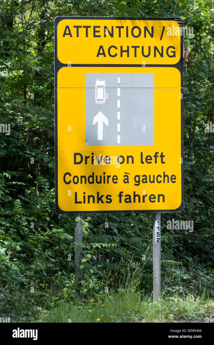 An Irish road sign is written in English, German and French for the