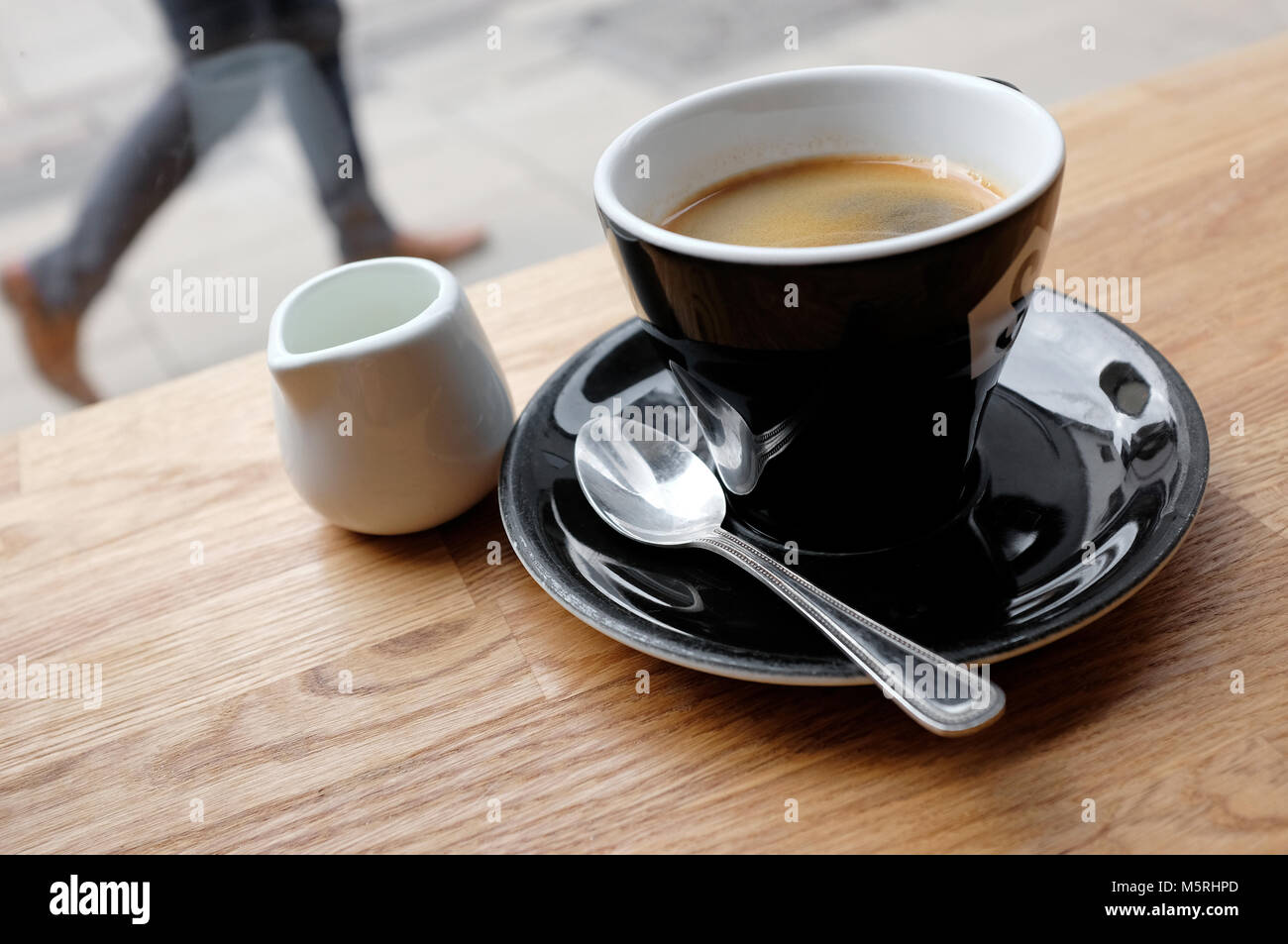 cup of americano coffee on cafe table, norwich, norfolk, england Stock Photo