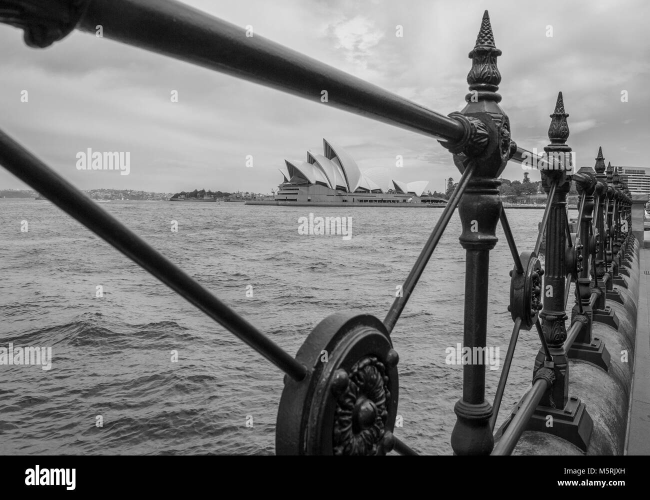 Monochrome view of Sydney Opera House through balustrade from Circular ...