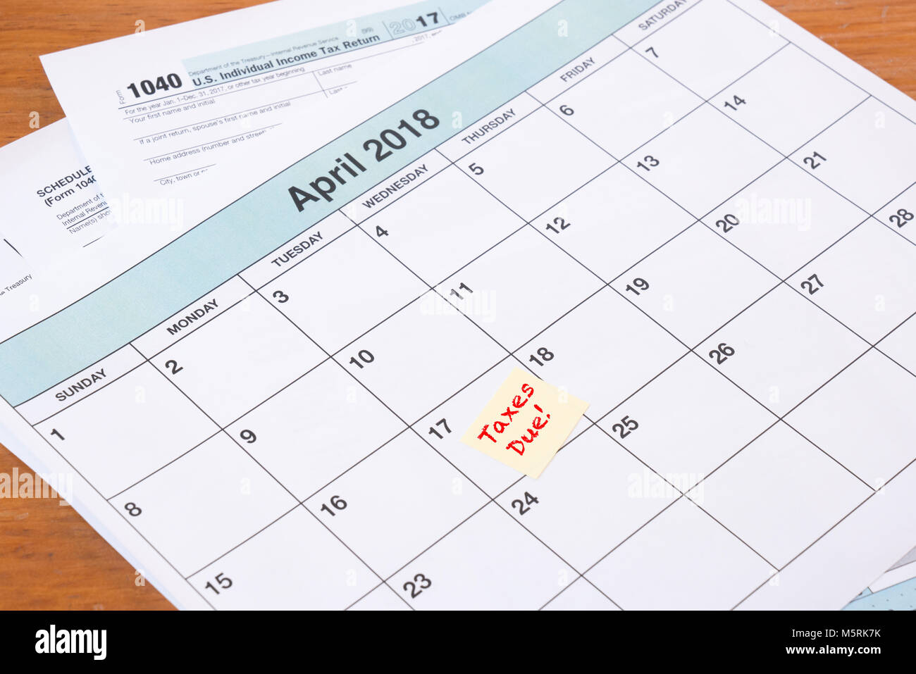 Calendar with reminder for taxes due on April 17th Stock Photo