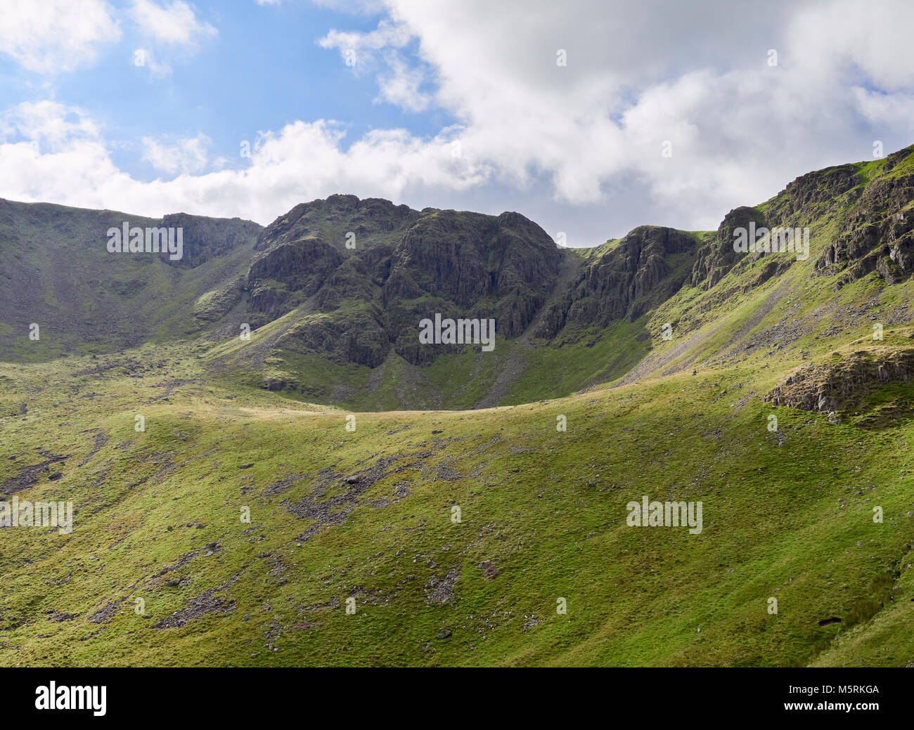 Summit of High Stile and Chapel Crags from the path leading to the summit of Red Pike in the English Lake District, UK. Stock Photo